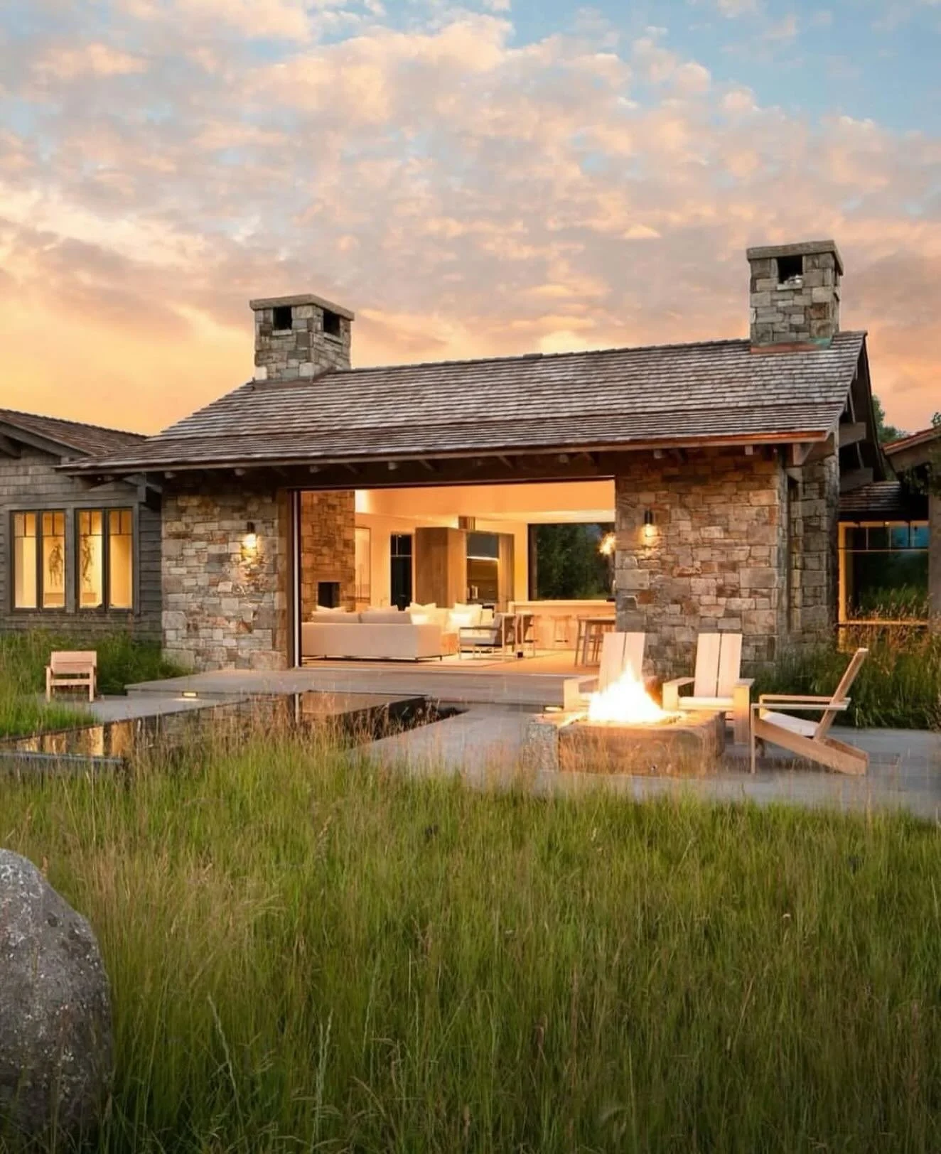 Perfection in Jackson!  Repost from @sutherlandfurniture
&bull;
Great Camp Adirondack Lounge Chair in teak was featured in @archdigest. This stunning Jackson, WY retreat seamlessly connects indoor and outdoor living. Designed by @messanaororke, these