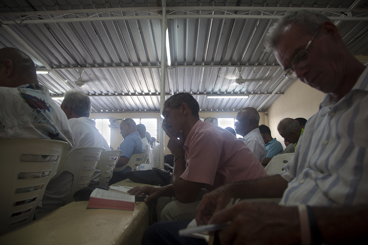 Man Reading Bible During Men's Instruction