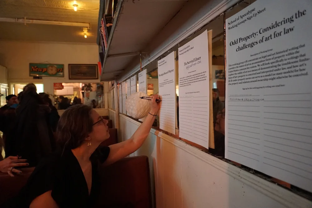 Michelle Jalowski signs up for a working group at Sunview Luncheonette in Greenpoint, Brooklyn.