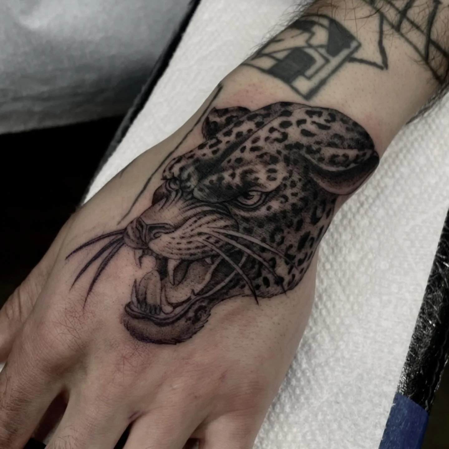 Fun hand WIP for EZ 🐆 made @redemptiontattoo 
&bull;
&bull;
&bull;
&bull;
&bull;
&bull;
&bull;
&bull;
&bull;
&bull;
#tattoo ##blackandgreytattoo #finelinetattoo #panthertattoo