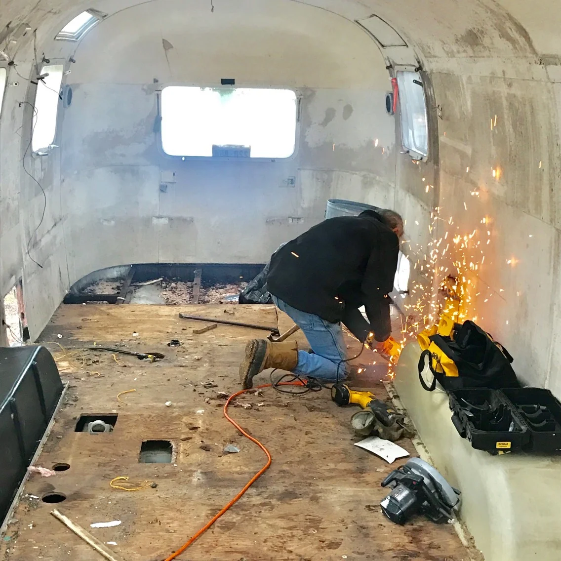 David hard at work on removing the floor. January 2017.
