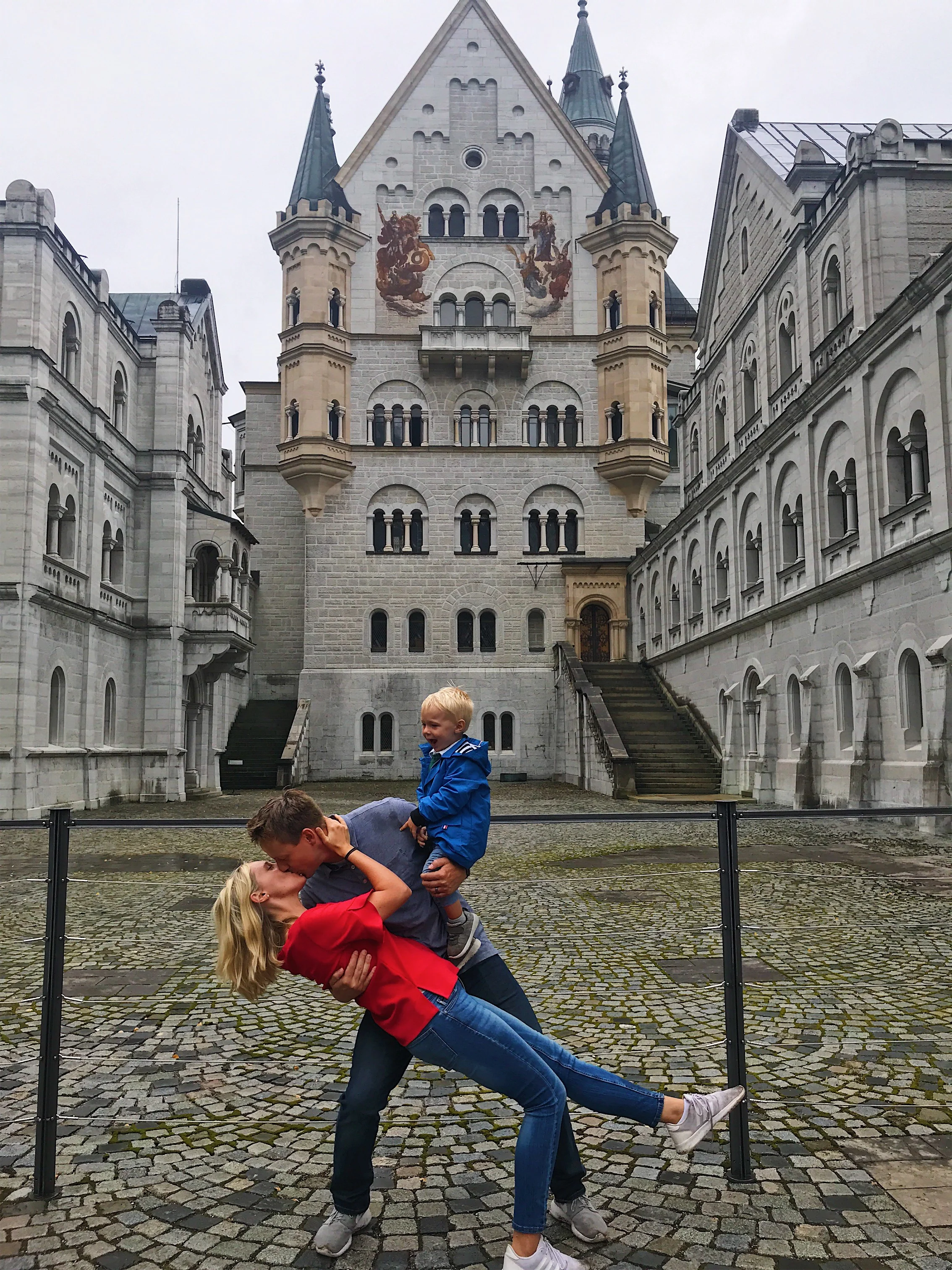 he holds our family together every day. this day he got to do it at neuschwanstein castle.