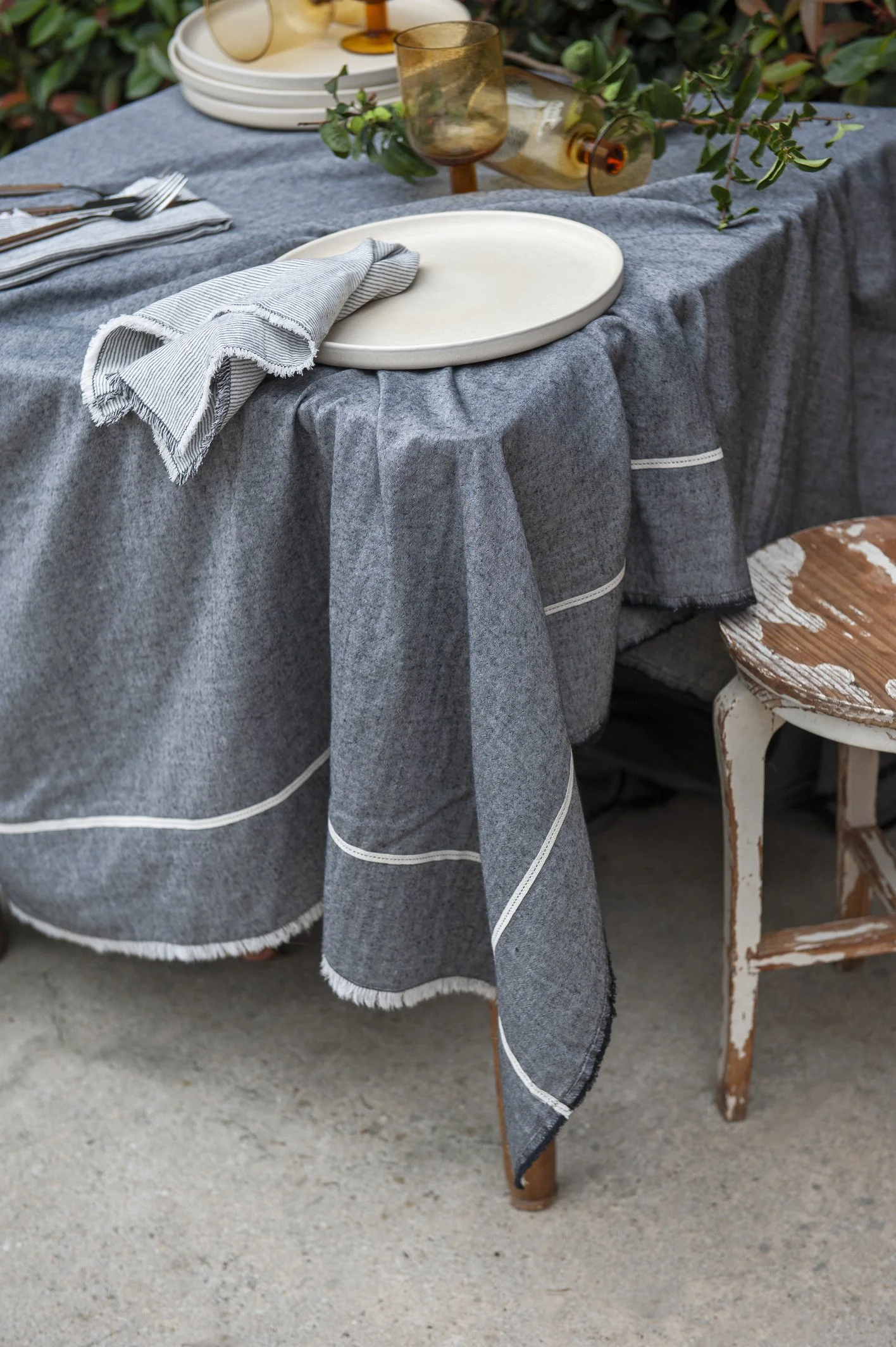 AW25_50_Table Cloth Charcoal Grey w Natural Narrow Trim Crossing Over 140 x 260_feeder stripe napkin charcoal.jpg