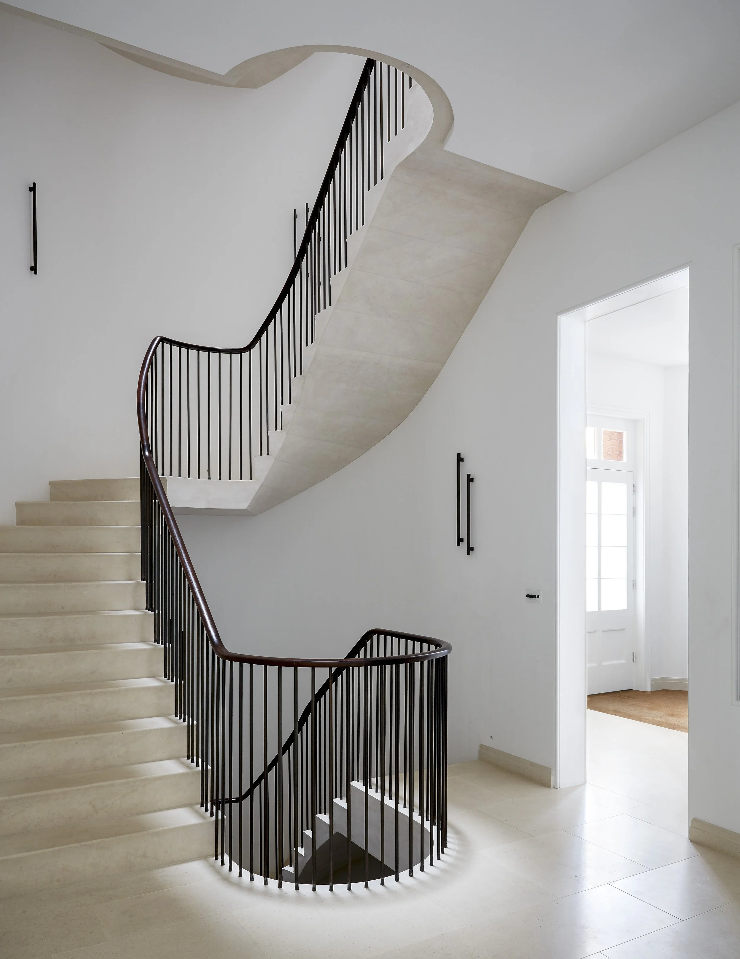 Cantilevered Moleanos stone staircase as sculptural feature in Chelsea home