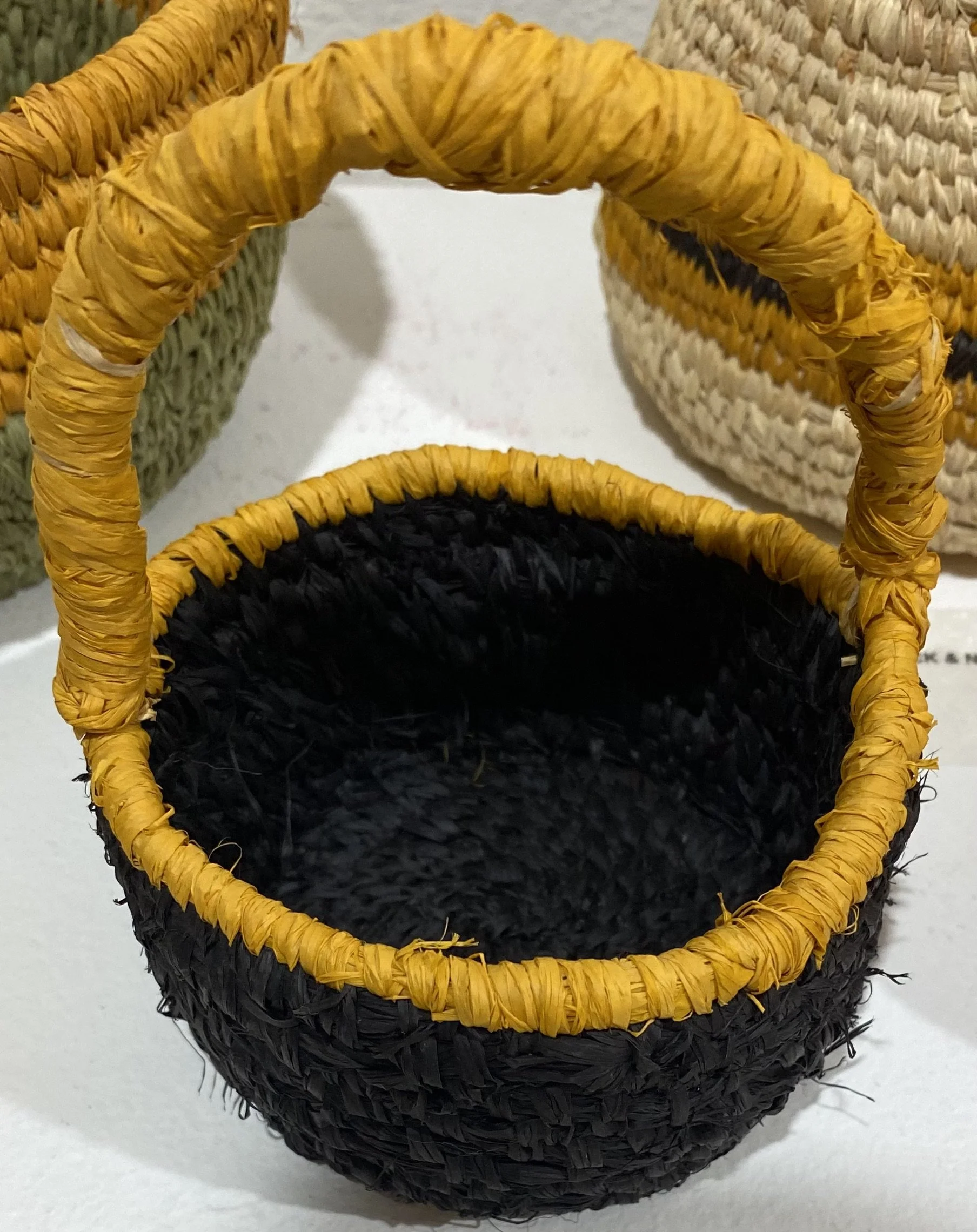 BLACK BASKET WITH YELLOW HANDLE     Raffia    Cathryn Charnock  $50