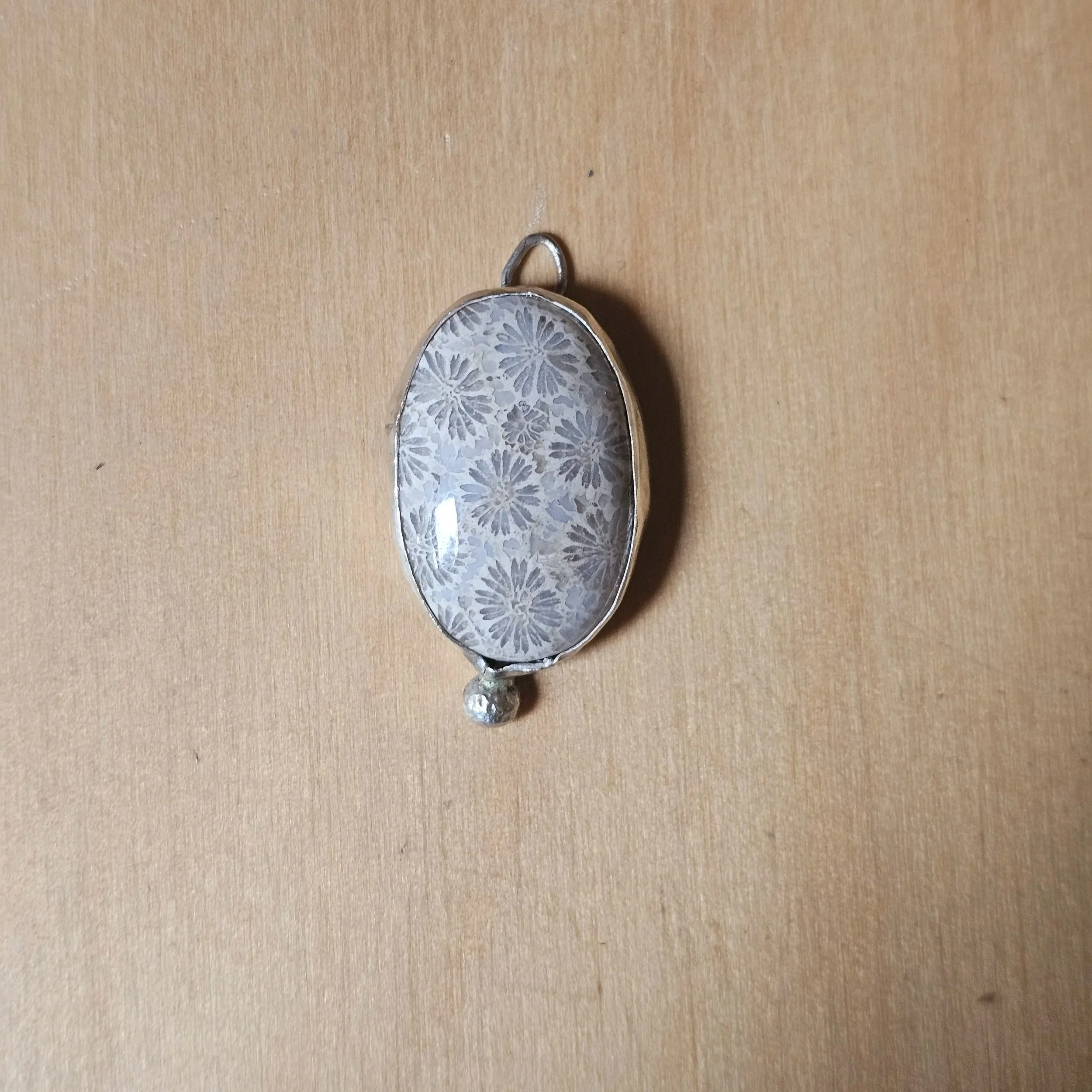 Sterling silver and fossilised coral