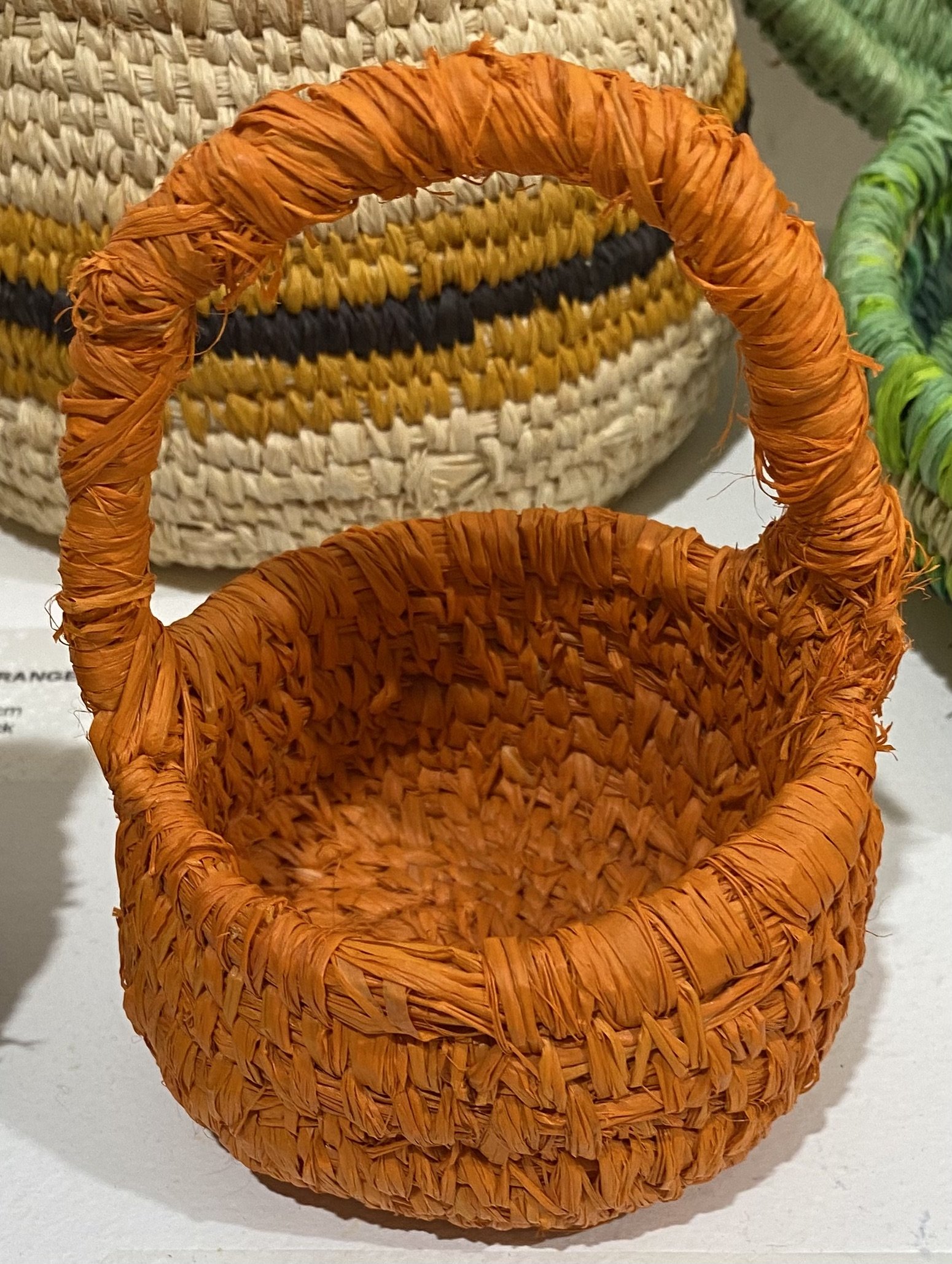  ORANGE BASKET WITH HANDLE     Raffia    Cathryn Charnock  $40