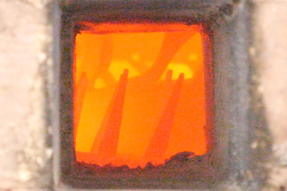 The view through the peep at the cones during a firing.