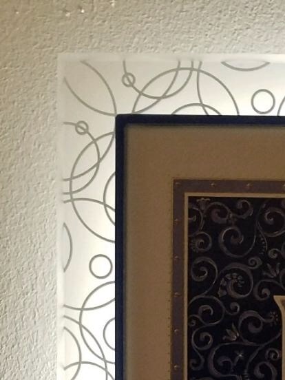 A detail of the corner of the lit up Ketubah.