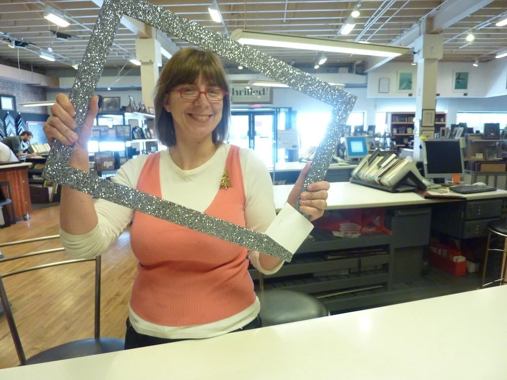 The original Vegas glitter frame is pictured.