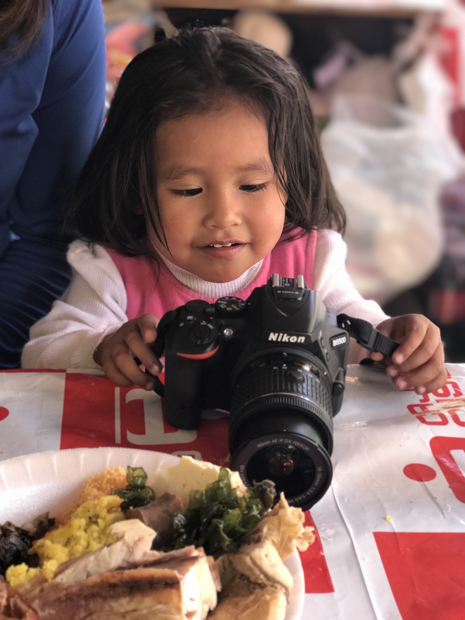 Ciera fascinated with our cameras, and the Chiriuchu in the foreground.
