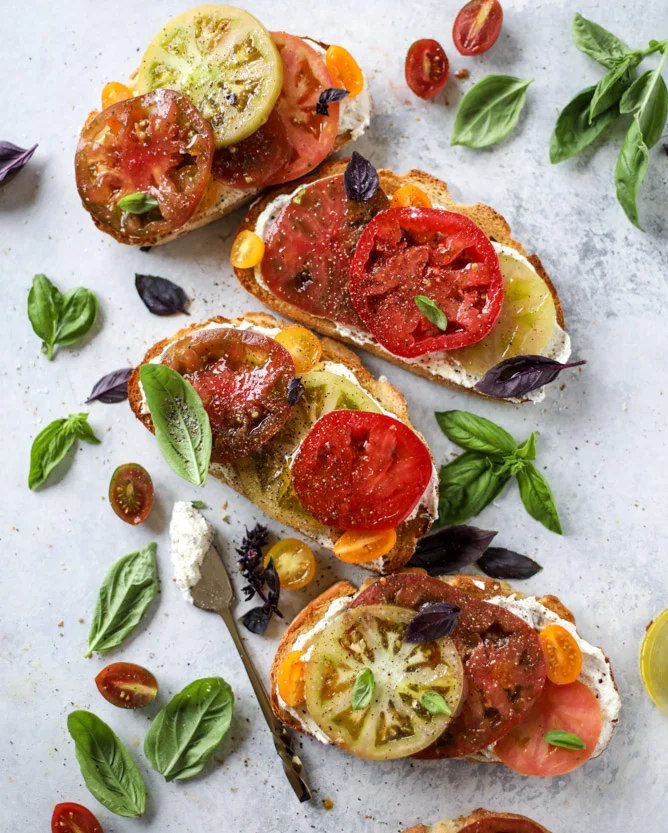 Heirloom Tomato Garlic Toast with Basil Whipped Fetta Image credit: Jessica, How Sweet Eats