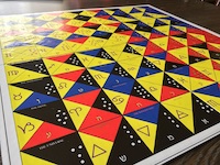 An Enochian chess board, with symbols, created by The Game Crafter .