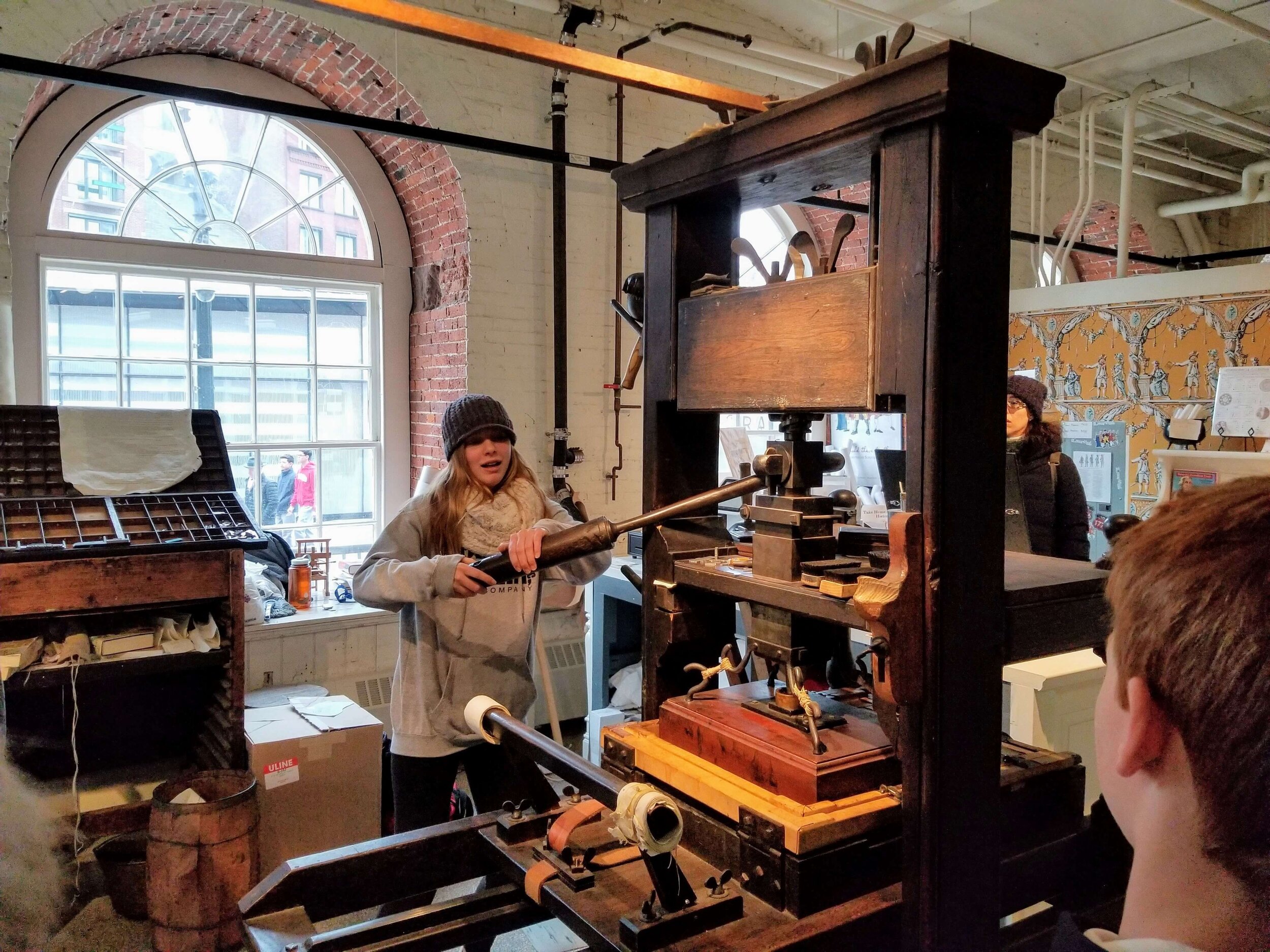  Getting a lesson in using the old printing press at Faneuil Hall to print out a copy of the Declaration of Independence 