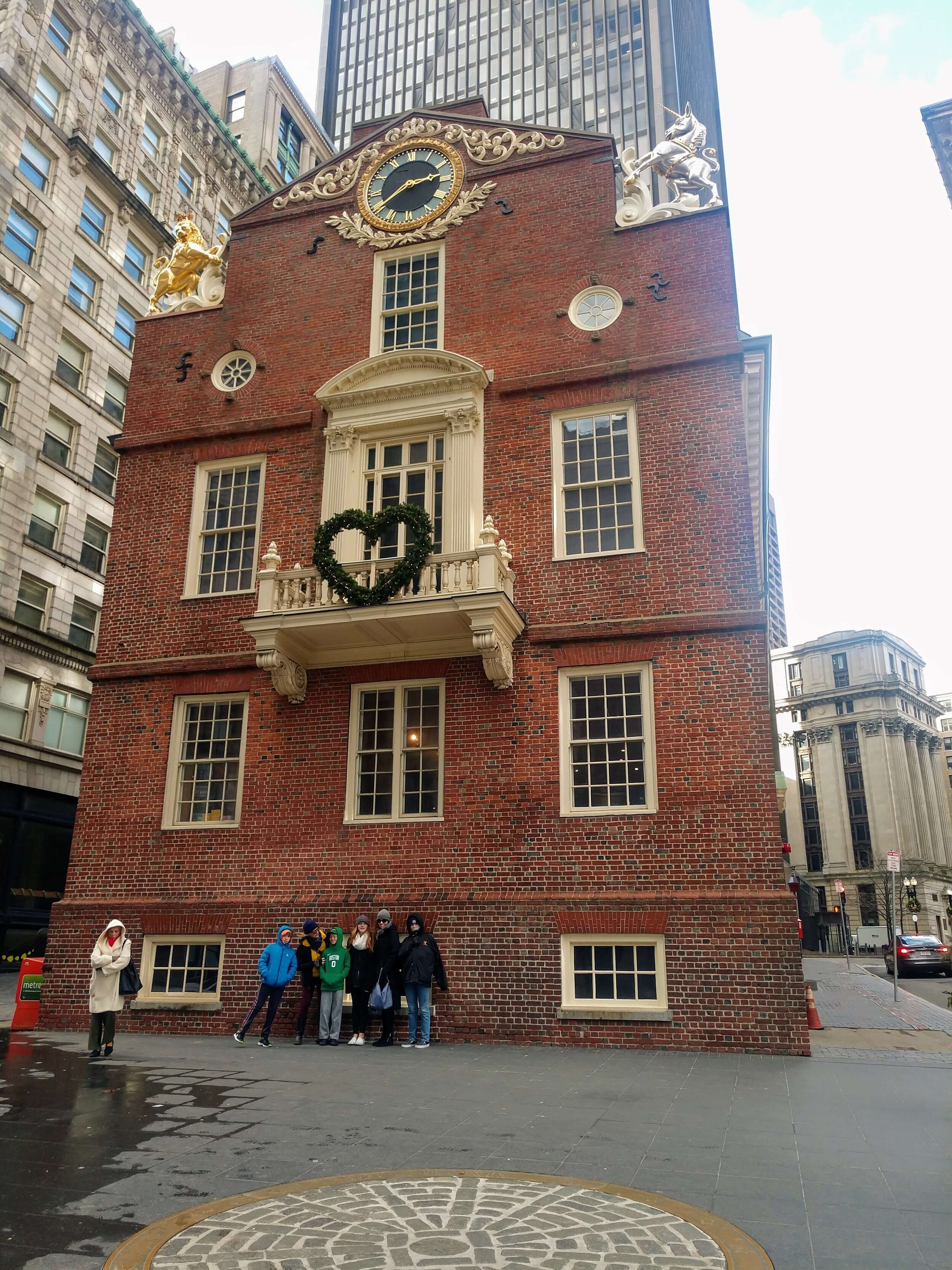  The Old State House and the medallion marking the spot where the Boston Massacre happened. This was one of our windiest days so everyone is extra bundled up. 