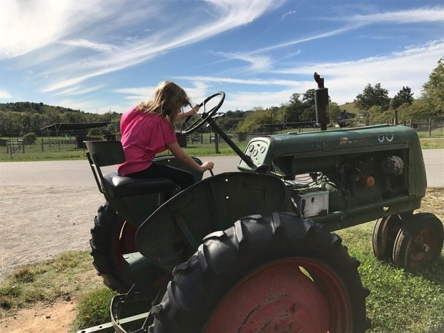 Playing around on a tractor on Biltmore Estate Farm