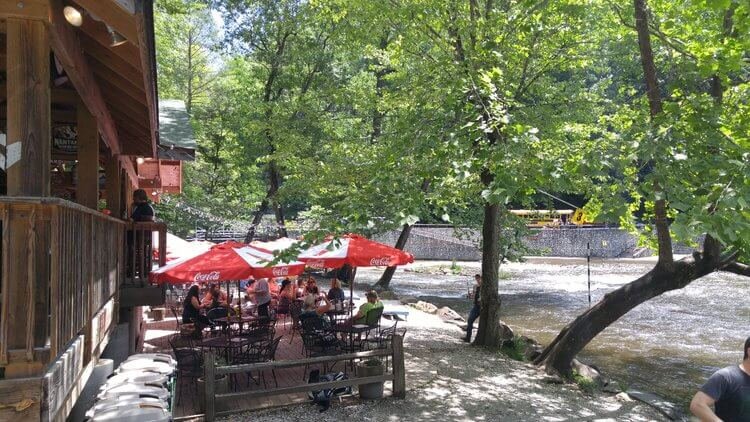 Big Wesser has tables on its porch and down by the river. A great place to kick back and watch kayakers practicing in the river.