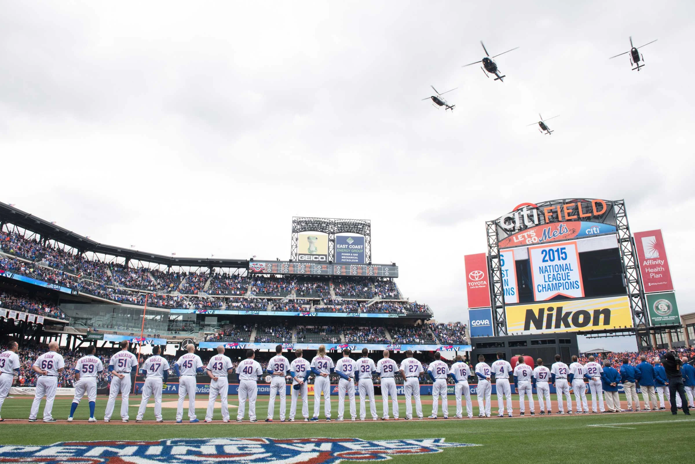 NYPD helicopters fly over Citi Field at the opening day ceremony for the New York Mets.