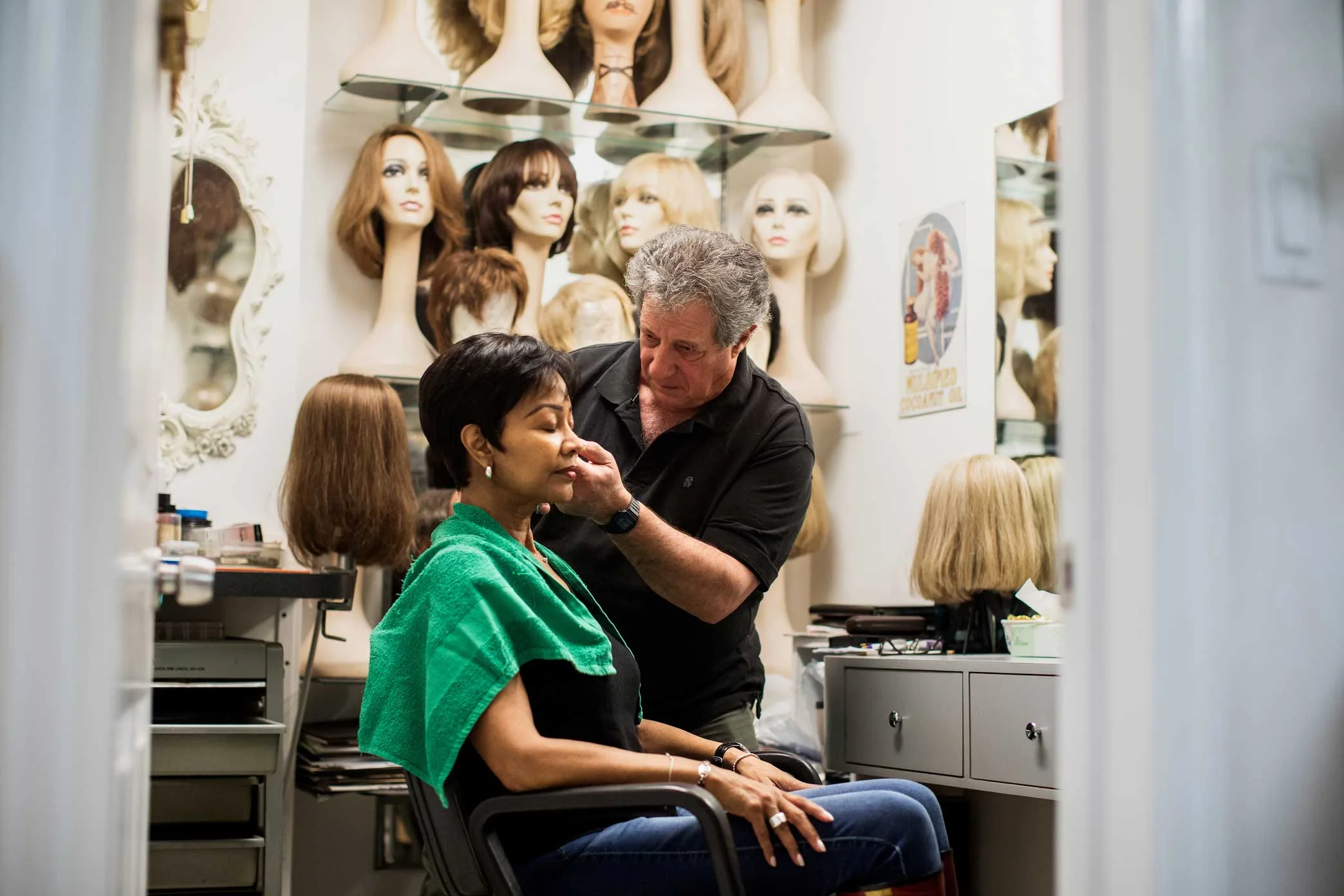 Nicholas Piazza combs out Sajata Robinson’s hair at his wig studio in Manhattan.