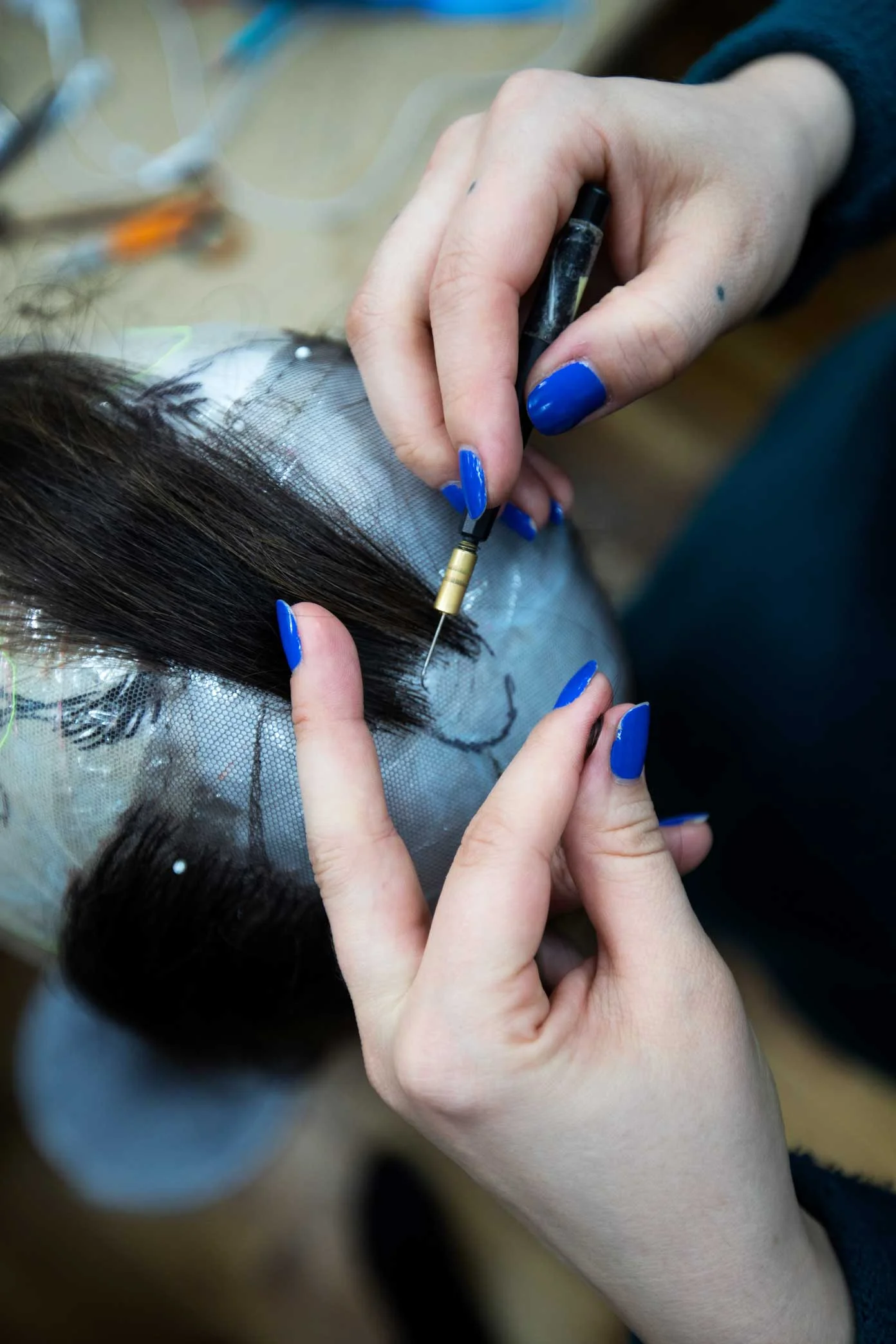 Chloe-nil Acerol works on a new wig at the Tom Watson Wig Design Studio in Manhattan. Tom Watson is the head of the wig and makeup department at the Metropolitan Opera. 