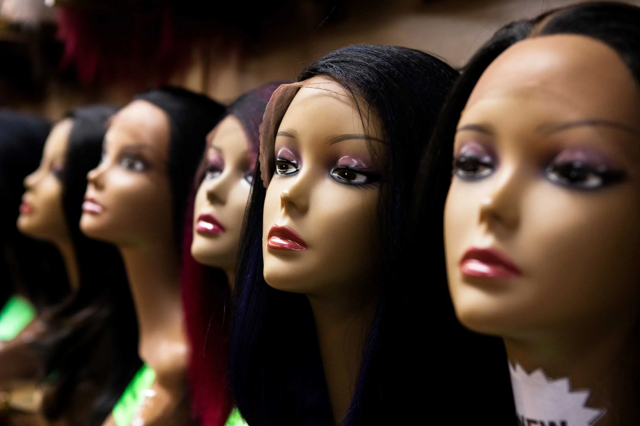 Wigs on display at Apollo Beauty Land in Harlem, Manhattan.