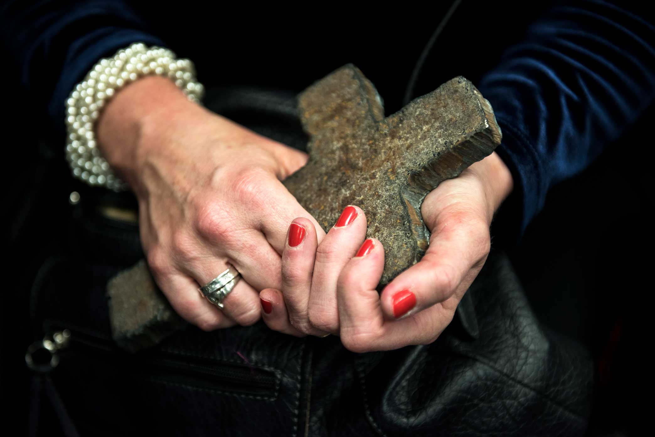  Susan Ryan-Loback holds a cross made out of the steel from the World Trade Center.&nbsp;Susan volunteered with her husband, Thomas Loback, at ground zero for months, providing support to the search, rescue and recovery efforts. Thomas passed away th
