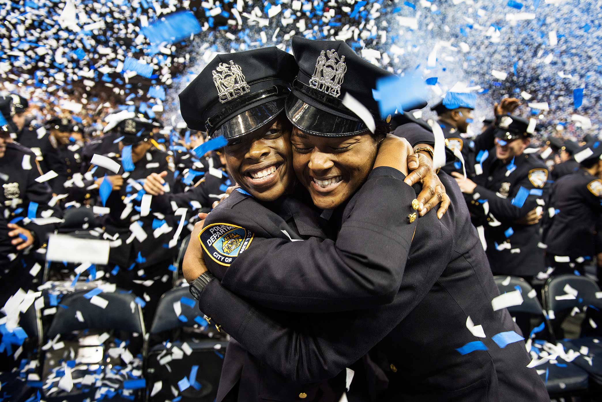  After 6 months in the police academy NYPD Graduate's celebrate during the NYPD Graduation ceremony at Madison Square Garden in Manhattan New York. 