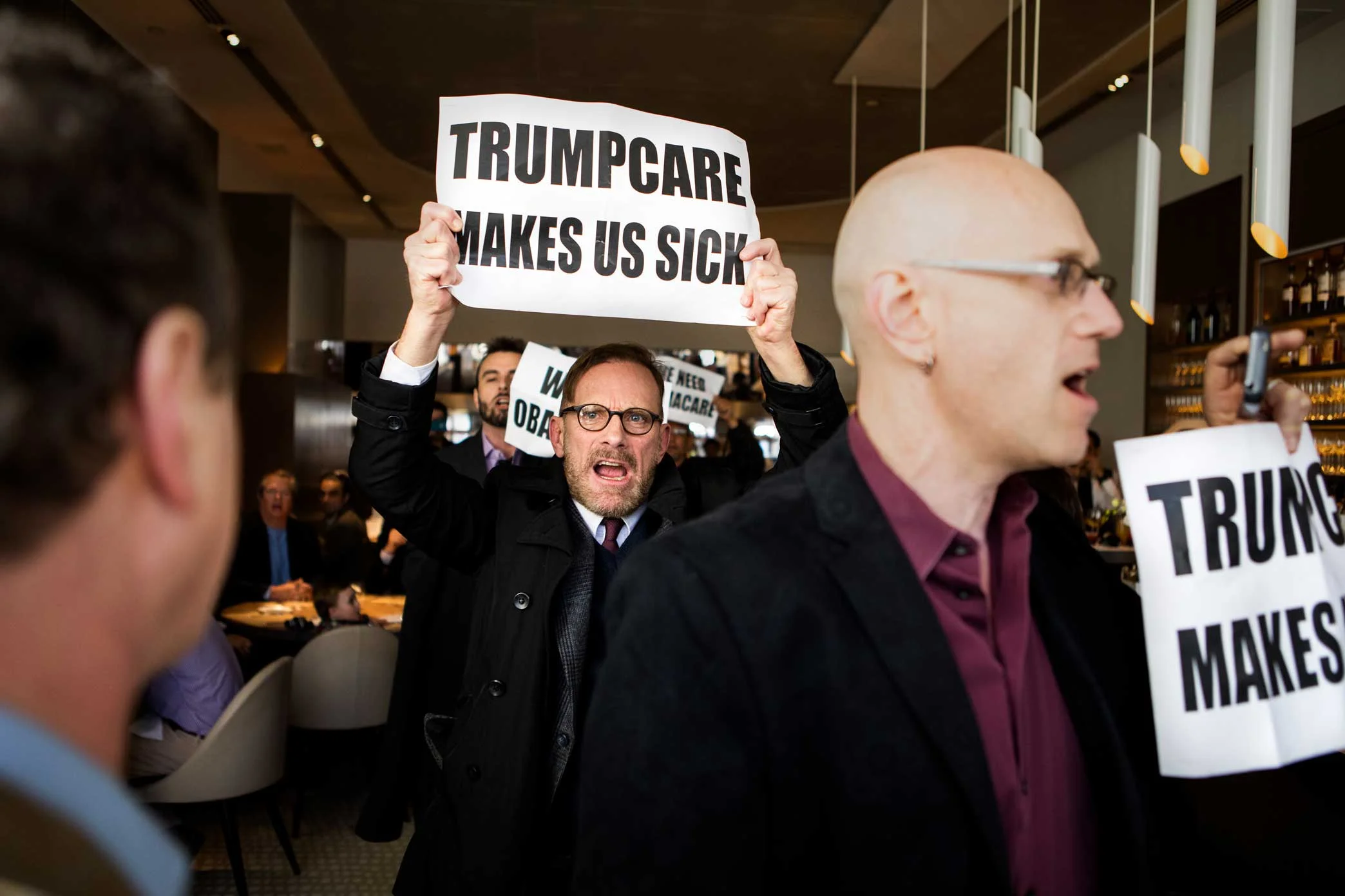 Protest at the Jean-Georges restaurant coordinated by the anti-Trump group Rise & Resist. Trump protesters are led out of the Jean-Georges Restaurant inside of the Trump International Hotel and Tower at Columbus Circle.