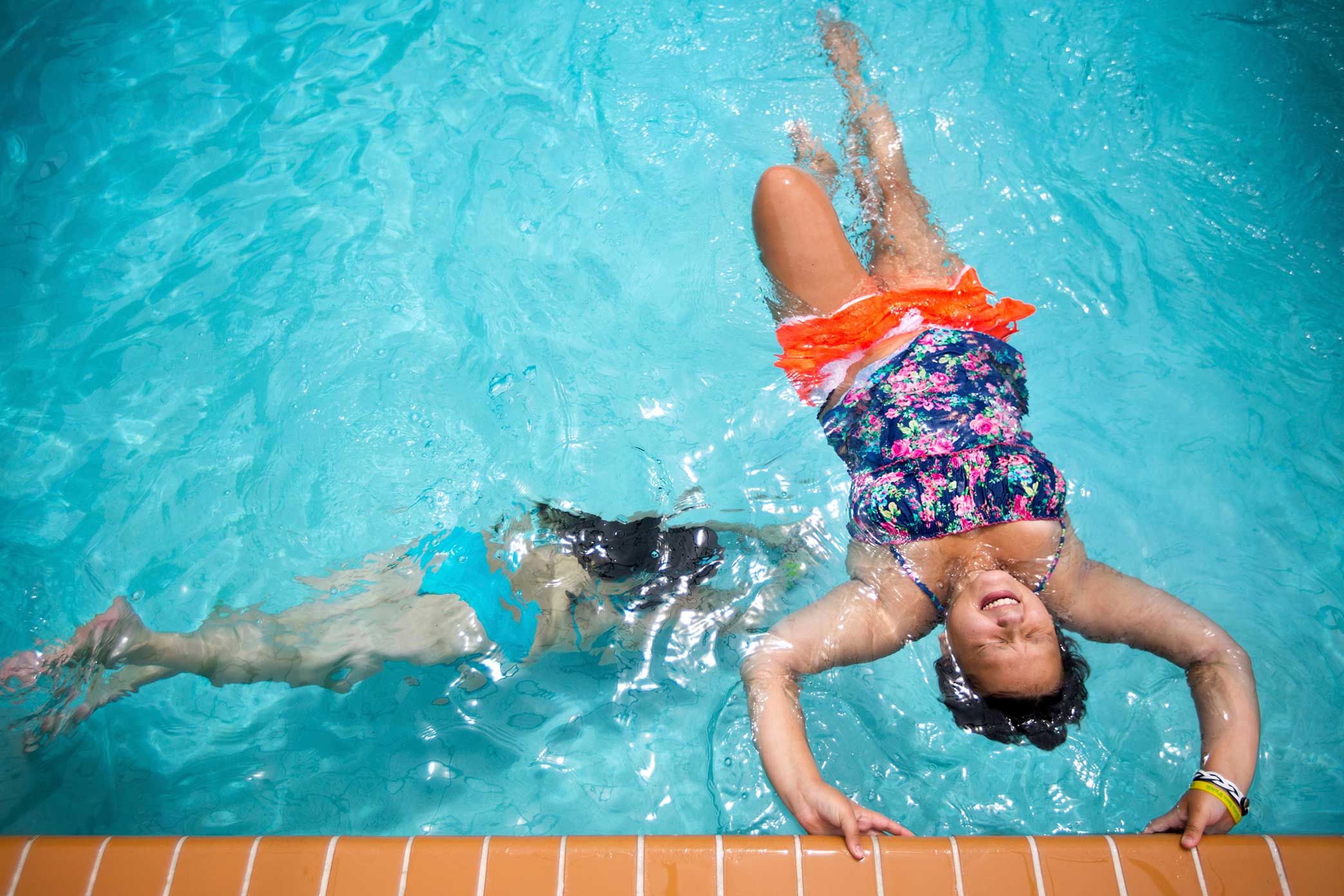  Faith Brown and her cousin Sami Russell play in the swimming pool at her home in Brooksville, Florida. "We swim everyday and play games in the pool. Its so much fun. I'm hoping to be on the swim team at my high school," said Faith. 14 year old Faith