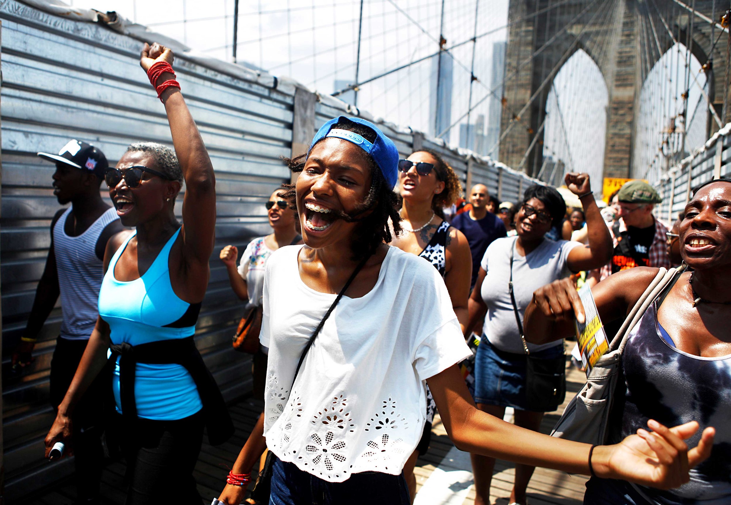  After attending a rally in Manhattan in honor of Trayvon Martin, many marched across the Brooklyn Bridge chanting "What do we want? Justice!"&nbsp;  The rally and march came one week after George Zimmerman was found not Guilty for the death of Trayv