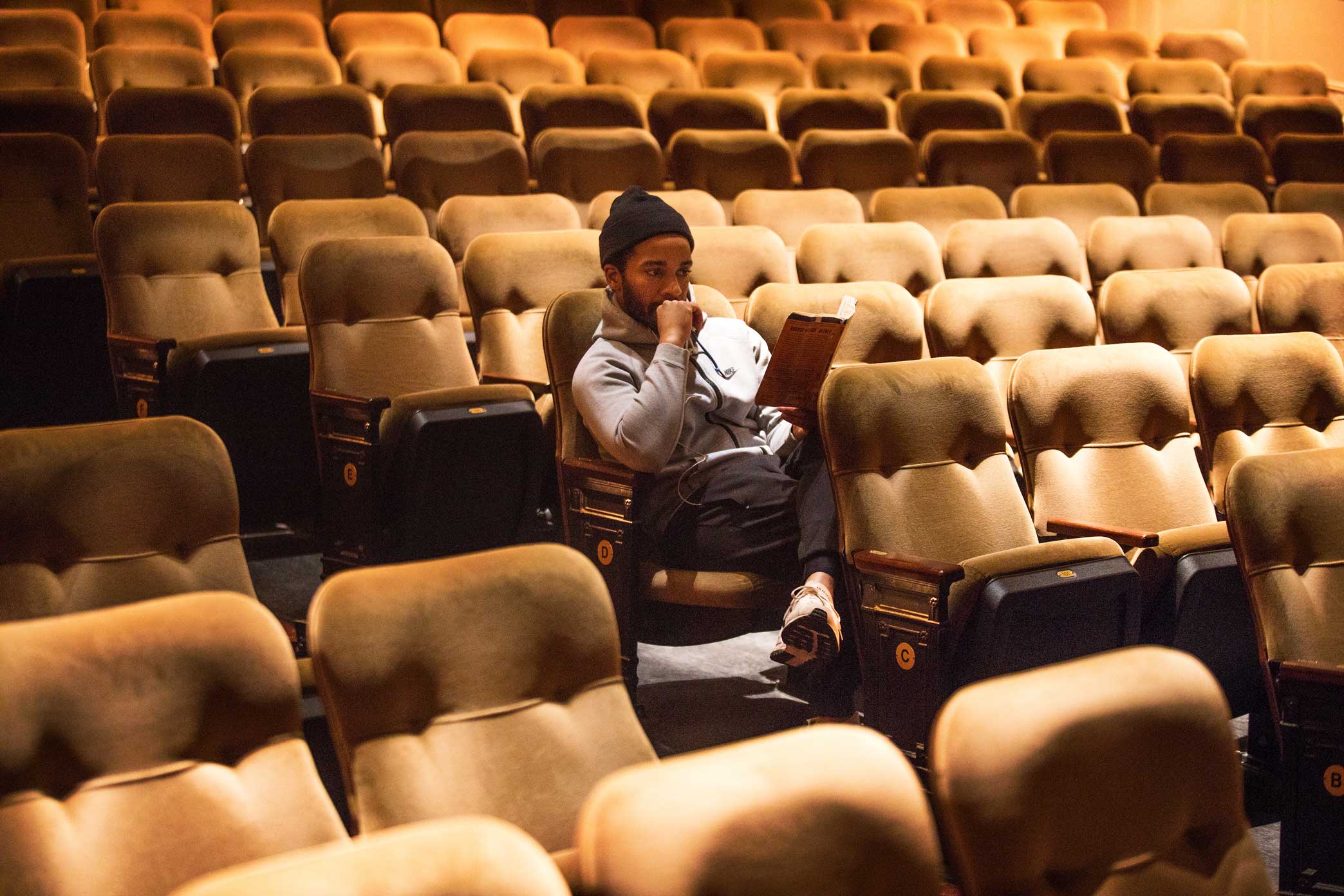  Mr. Holland reading “Jitney” before a matinee performance. “I hear new parts of the play all the time, things that I thought I understood,” he said. 