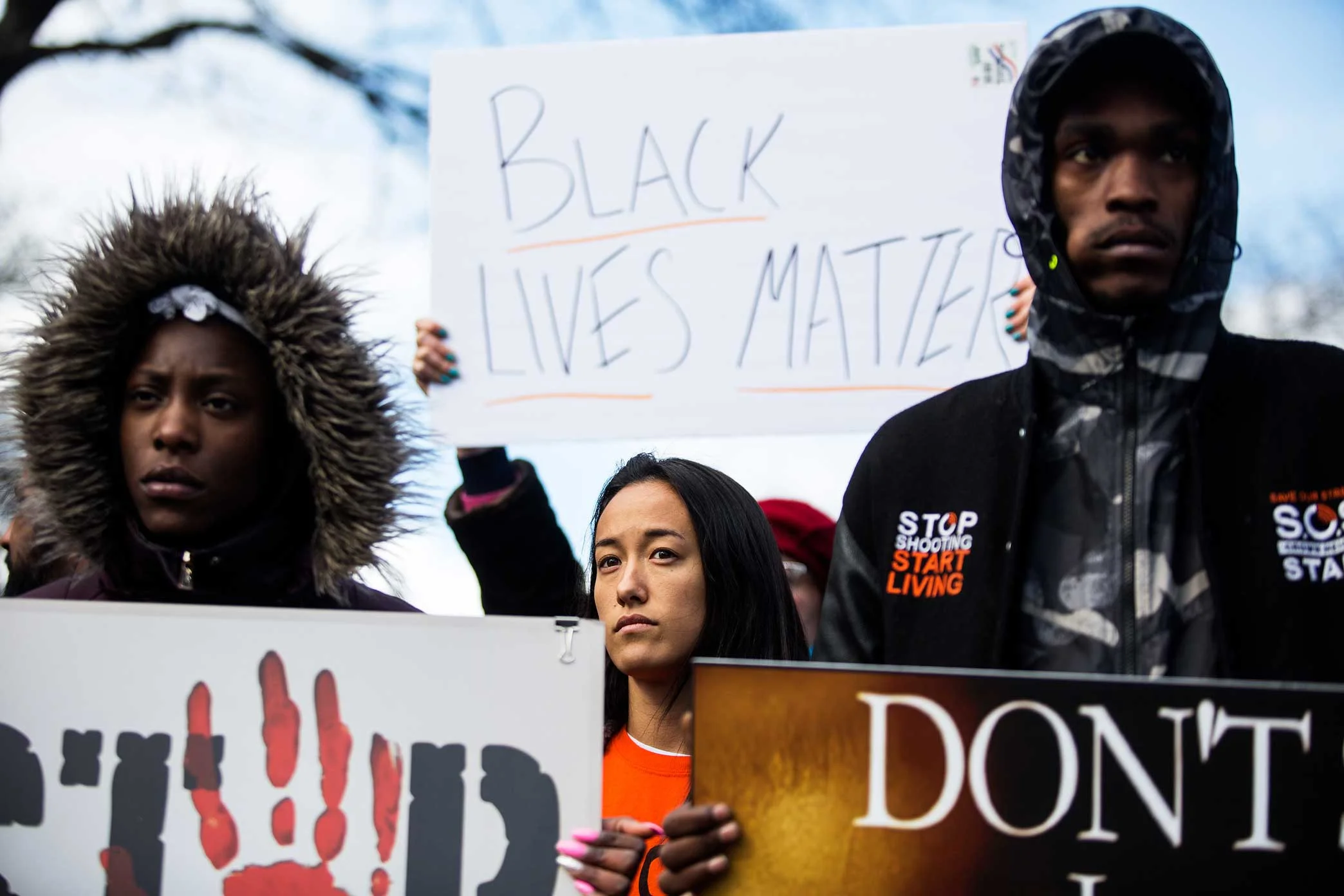Protesters march in the street stopping traffic on the corner of Utica Ave and Empire Blvd in Brooklyn. Community members gather for a candle light vigil for Saheed Vassell.