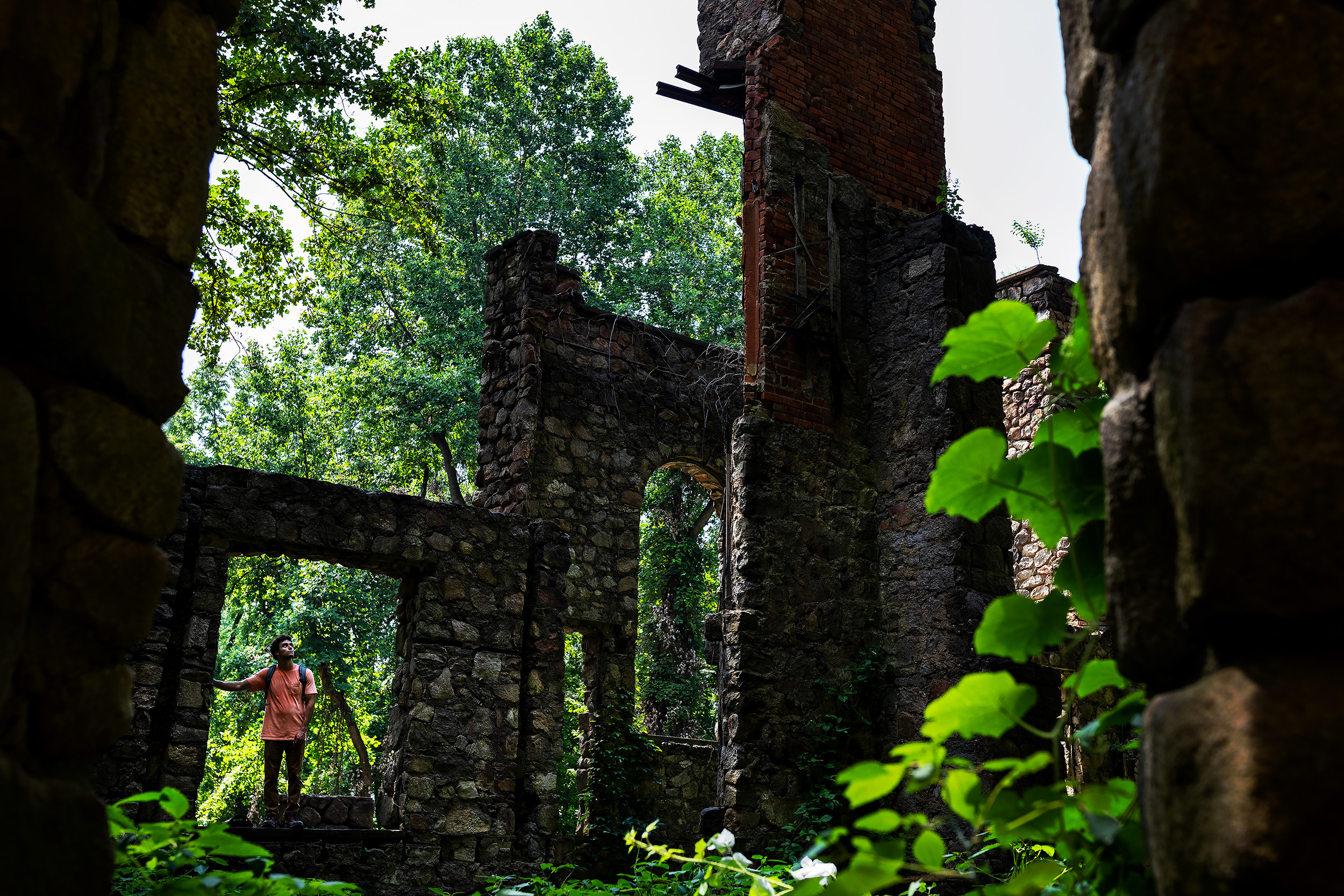 A visitor tours the old ruins of the Cornish Estate in Cold Spring, New York. In 1958, a fire destroyed most of the mansion leaving the Cornish’s grand estate in ruins. Today those ruins are overgrown and gradually have been reclaimed by the forest.