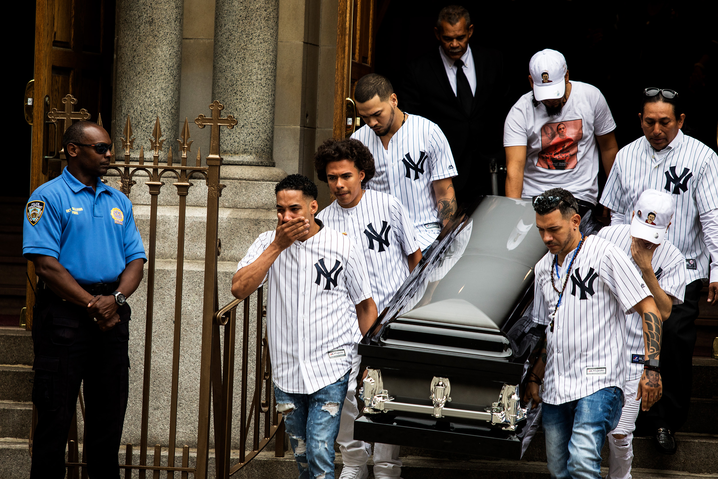 Mourners leaving Our Lady of Mount Carmel in the Bronx on Wednesday at the funeral of Lesandro Guzman-Feliz, who the police said was killed by gang members last week outside a bodega. 