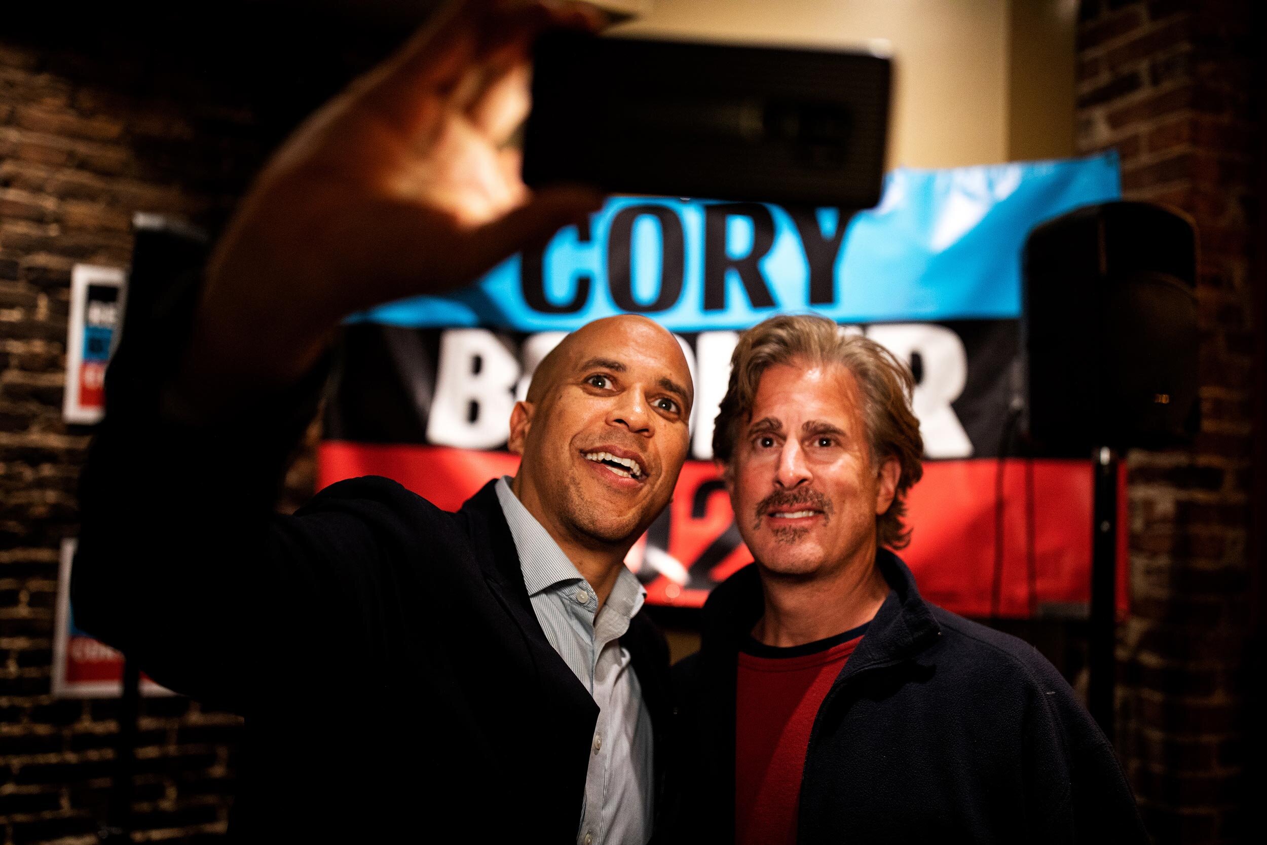  Democratic candidate, Cory Booker, takes a selfie during a meet and greet with voters at the Portsmouth Brewery in Portsmouth, New Hampshire.    