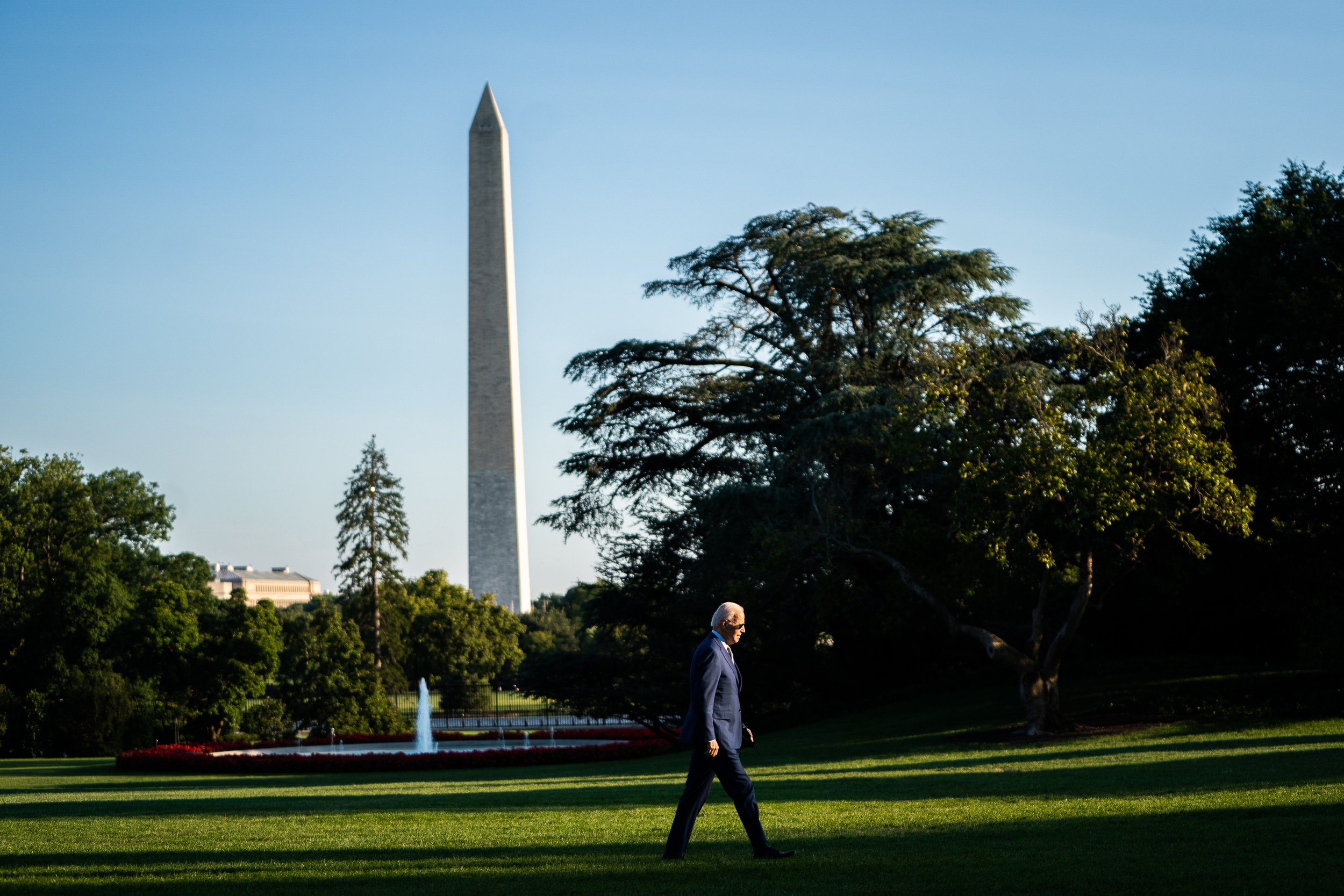  US President Joe Biden makes his way to the Oval Office on the South Lawn of the White House. 