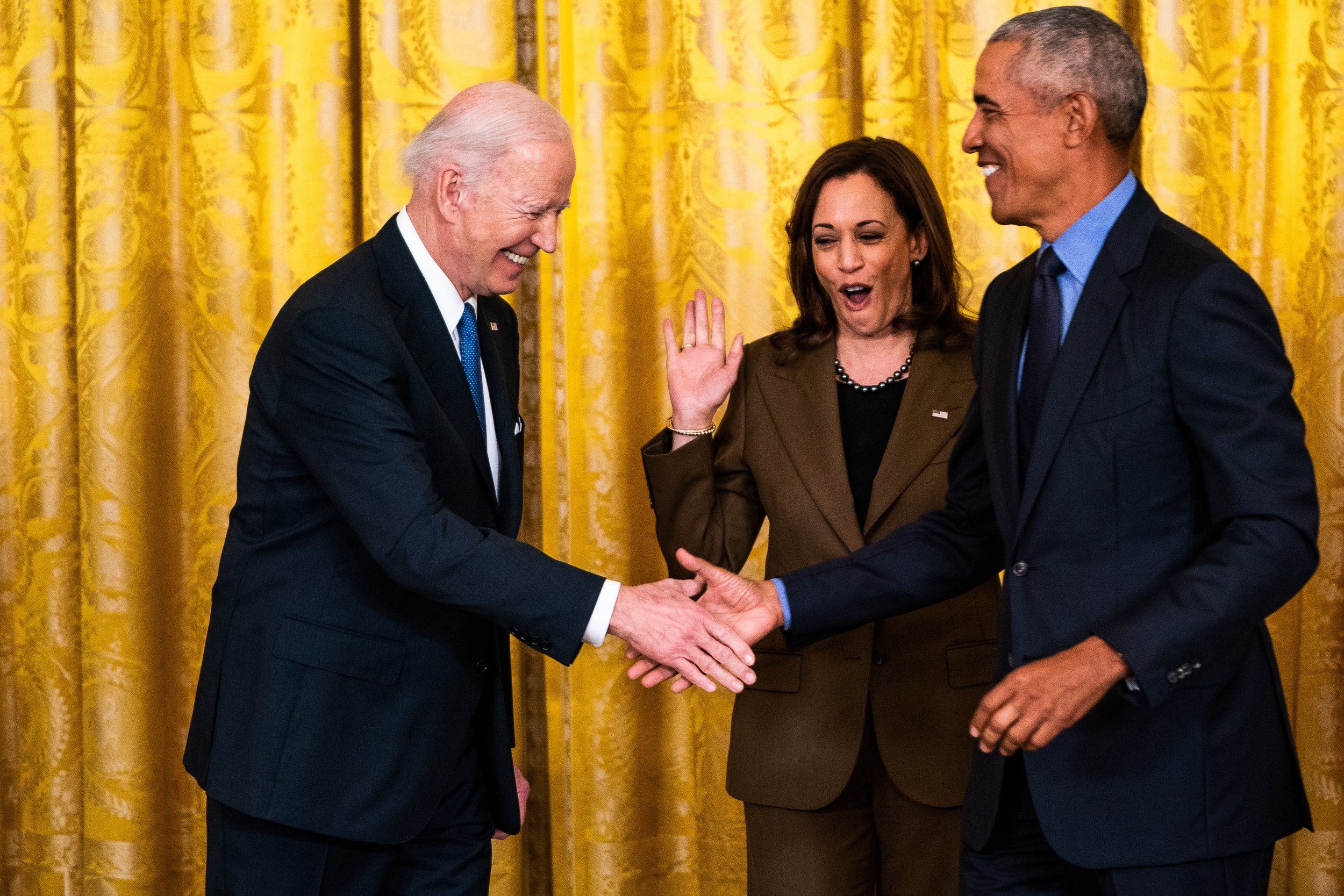  Vice President Kamala Harris reacts to US President Joe Biden and Former President Barack Obama during an event on the Affordable Care Act and lowering health care costs for families in the East Room of The White House. 