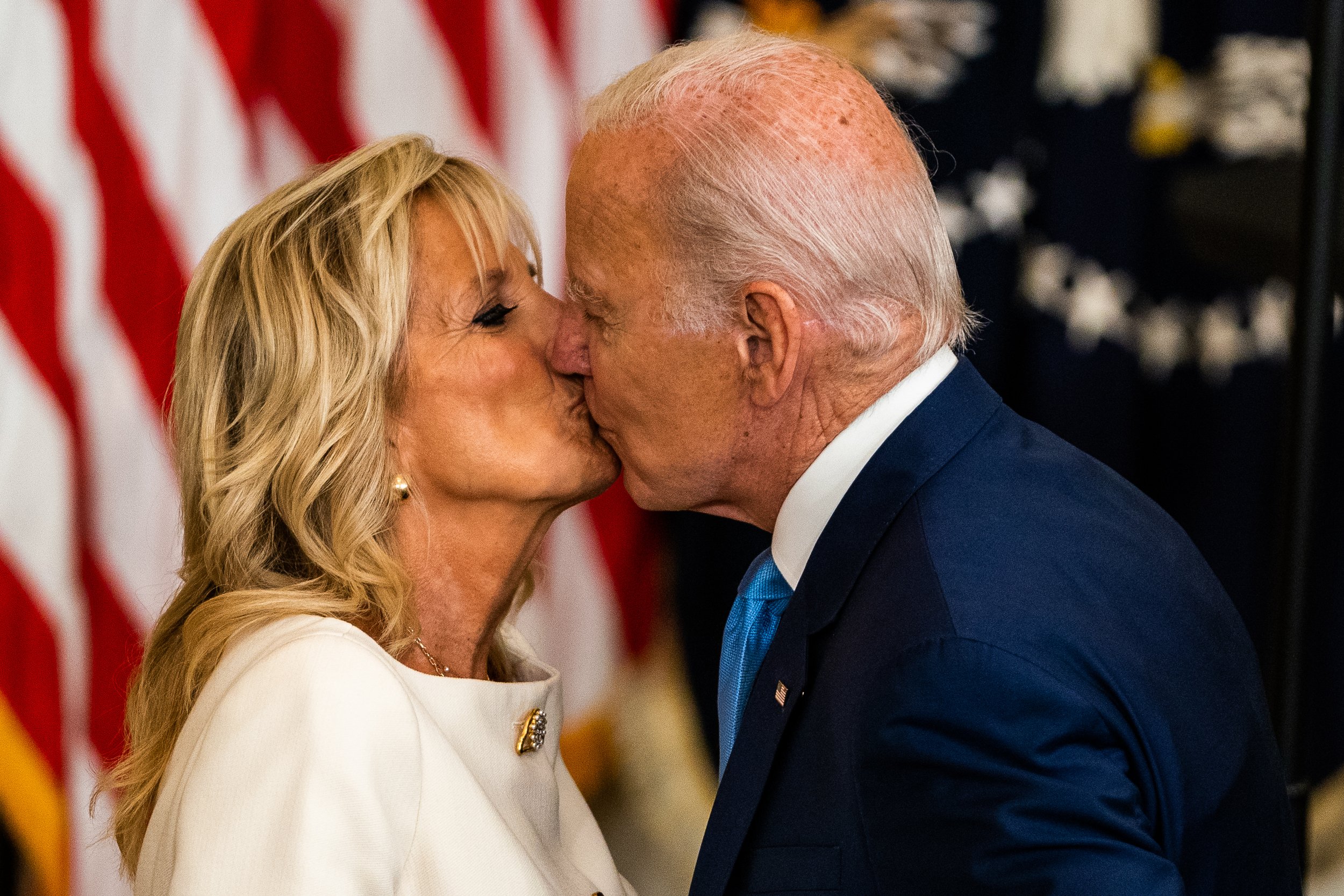  US President Joe Biden and First Lady Jill Biden share a kiss during the unveiling of the Obama's official White House portraits ceremony in the East Room. 