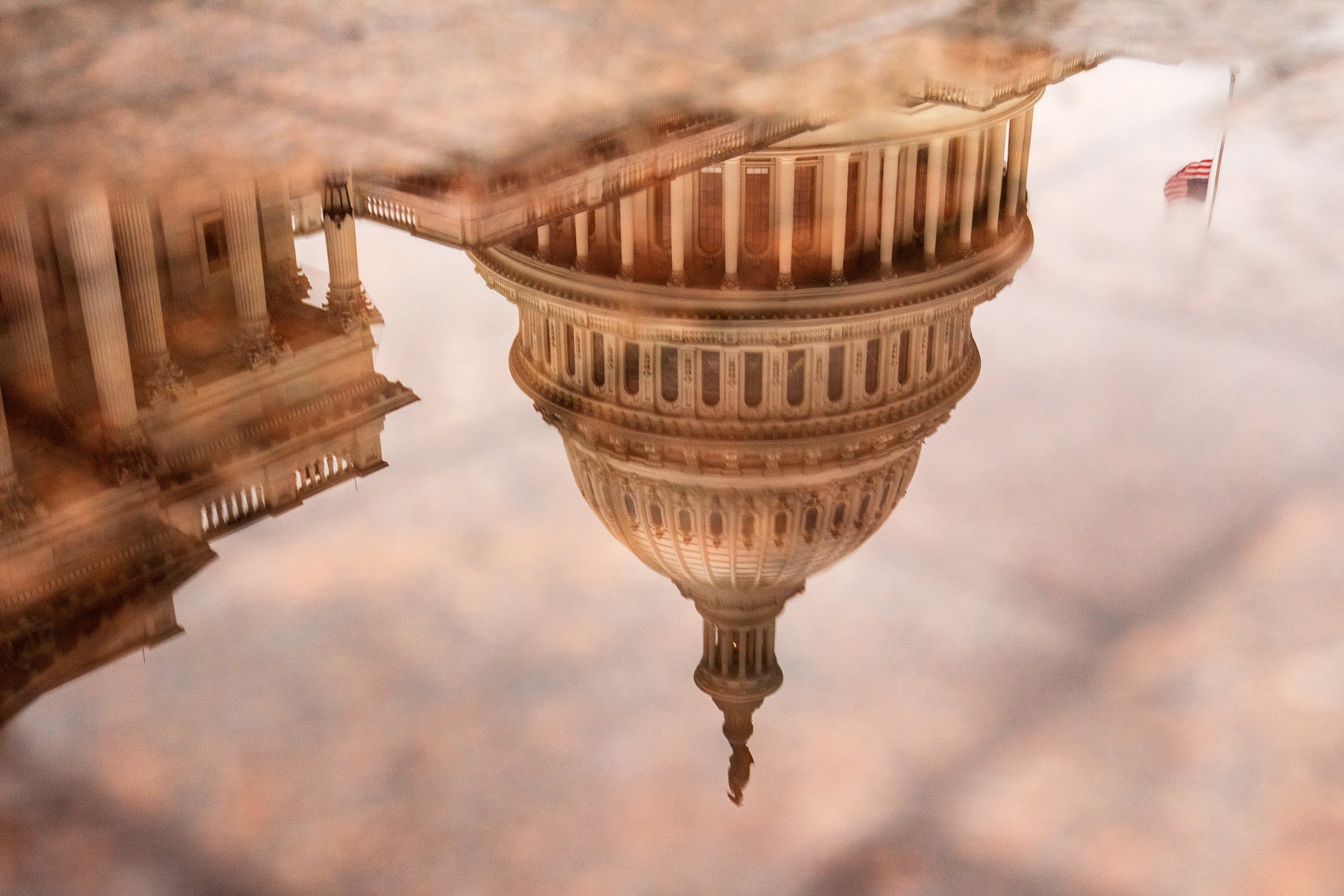  Reflection of the Capitol during the third day of the Senate Impeachment trials at the Capitol.  