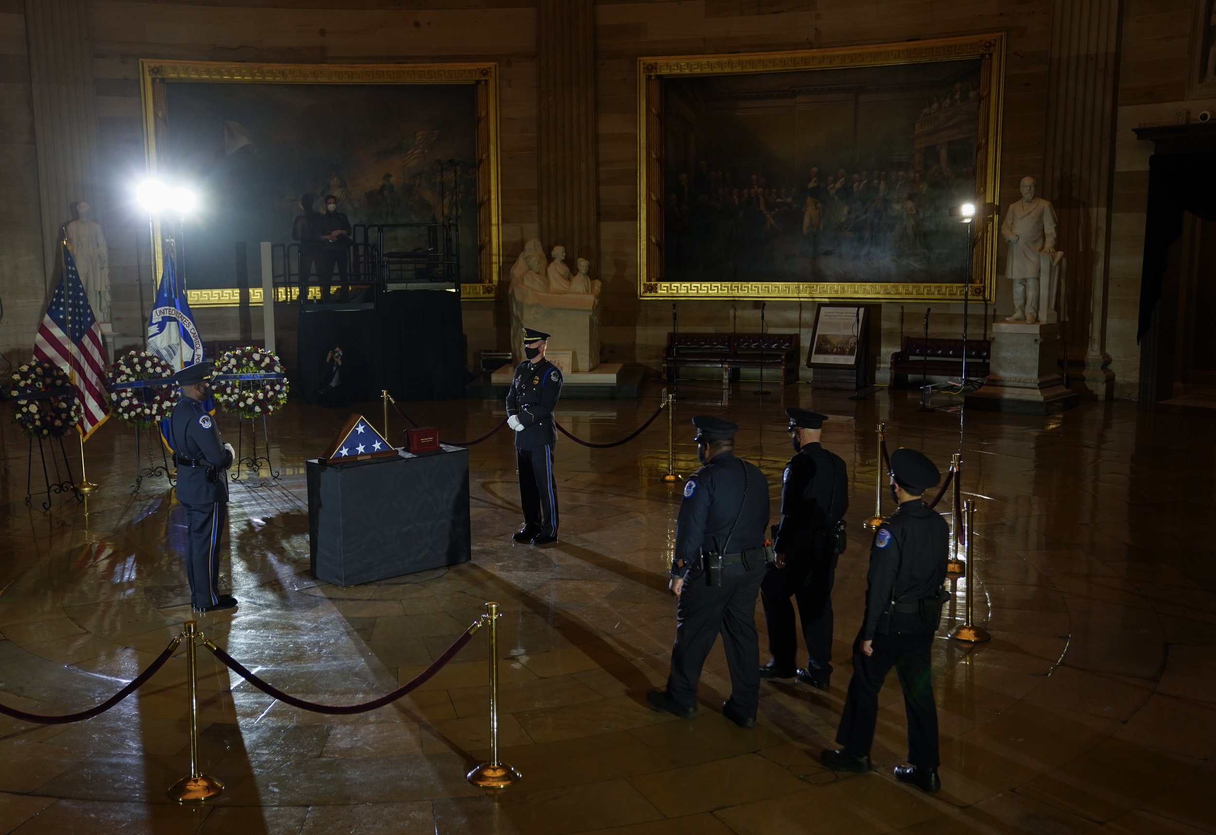  U.S. Capitol Police pay their respects before a ceremony memorializing U.S. Capitol Police Officer Brian D. Sicknick, 42, as he lies in honor in the Rotunda of the Capitol. Officer Sicknick was responding to the riot at the U.S. Capitol on Wednesday