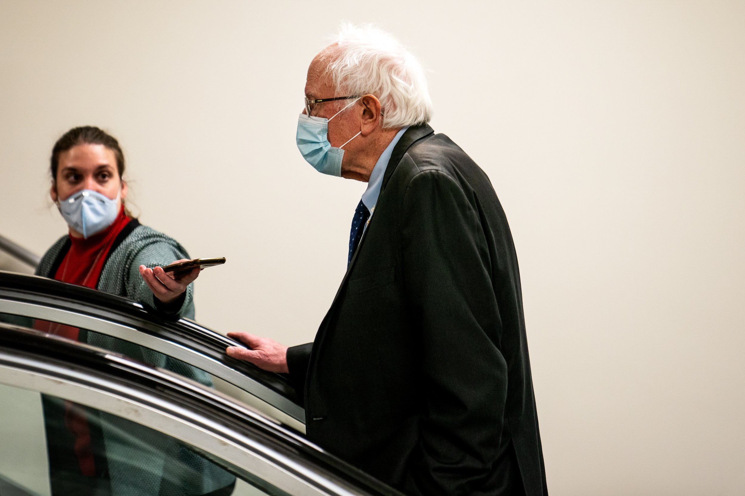  Sen. Bernie Sanders (I-VT) speaks to reporters in the Senate subway at the U.S. Capitol.  