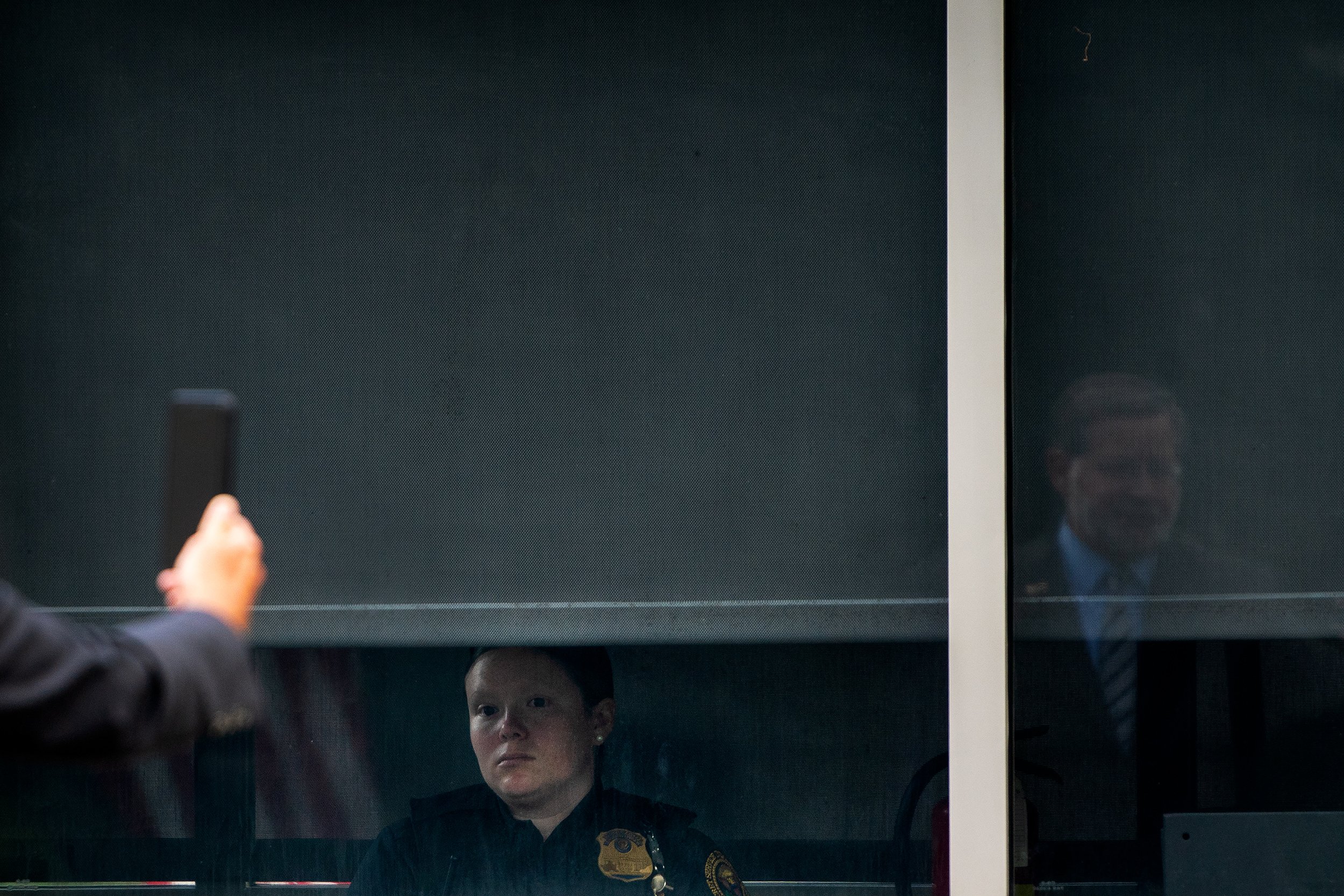  A US Secret Service Officer watch as United State Senator Gary Peters (D-MI) records a video following US President Joe Biden signing of the “HAVANA Act of 2021” and the “K-12 Cybersecurity Act of 2021,” into law at the White House. 