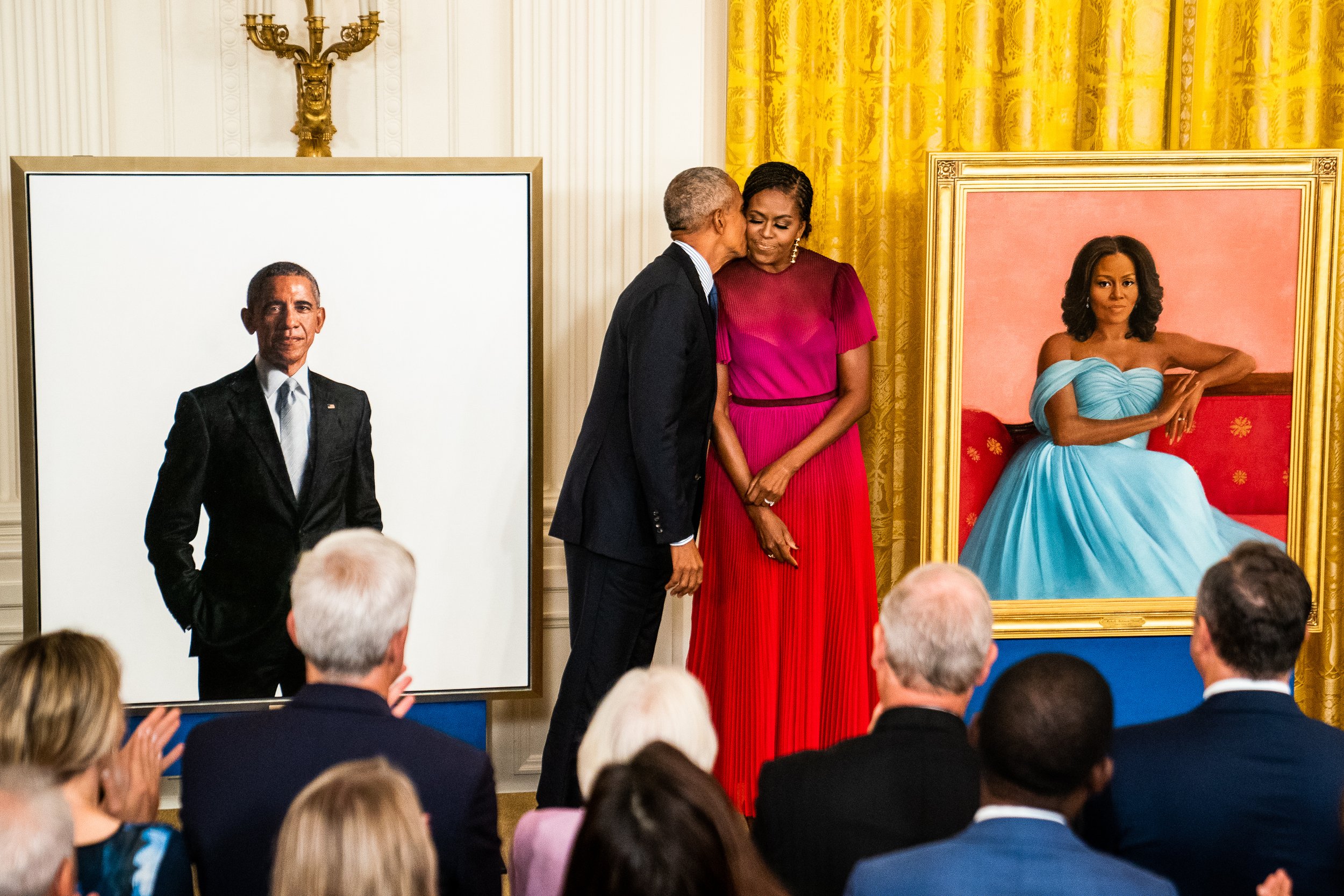  Former President Barack Obama kisses his wife former first lady Michelle Obama after they unveiled their official White House portraits during a ceremony in the East Room of the White House. 