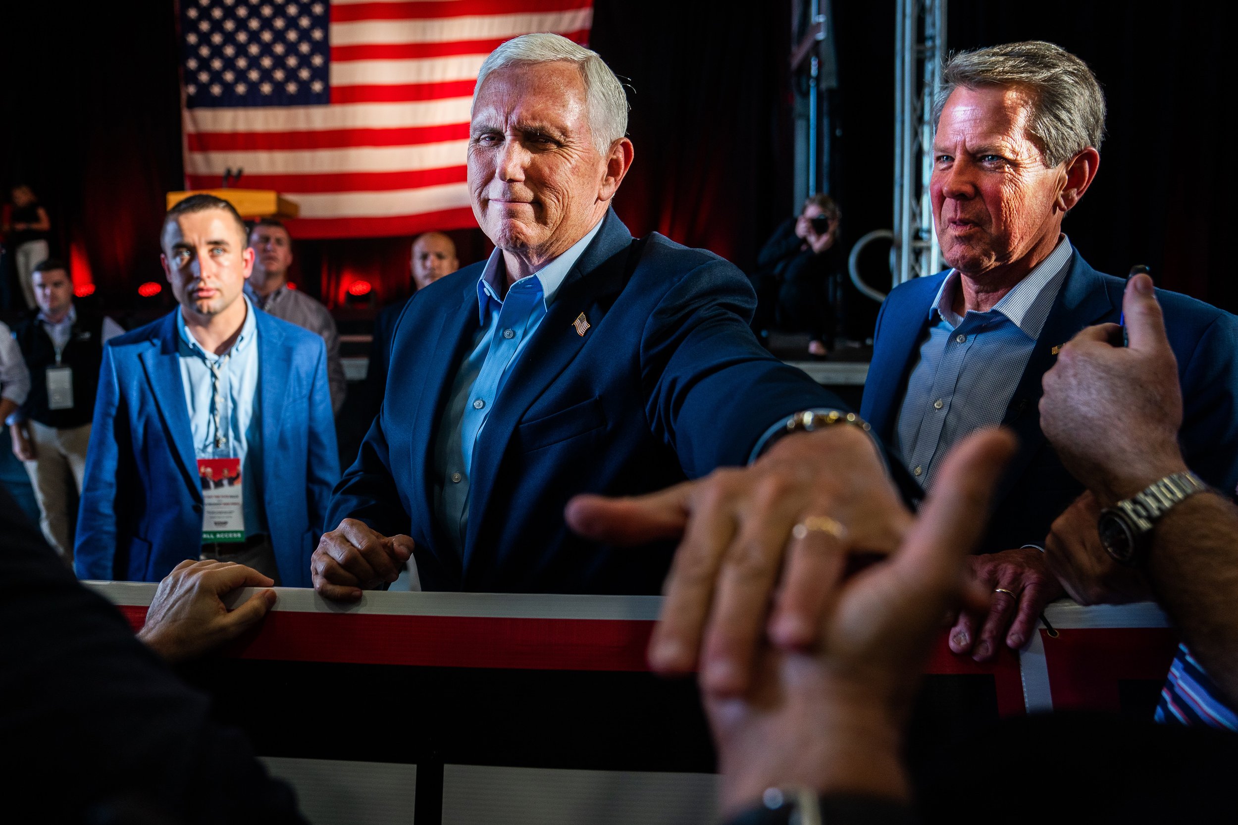  Former Vice President Mike Pence and Georgia Governor Brian Kemp greet supporters during a rally at the Cobb County International Airport.  