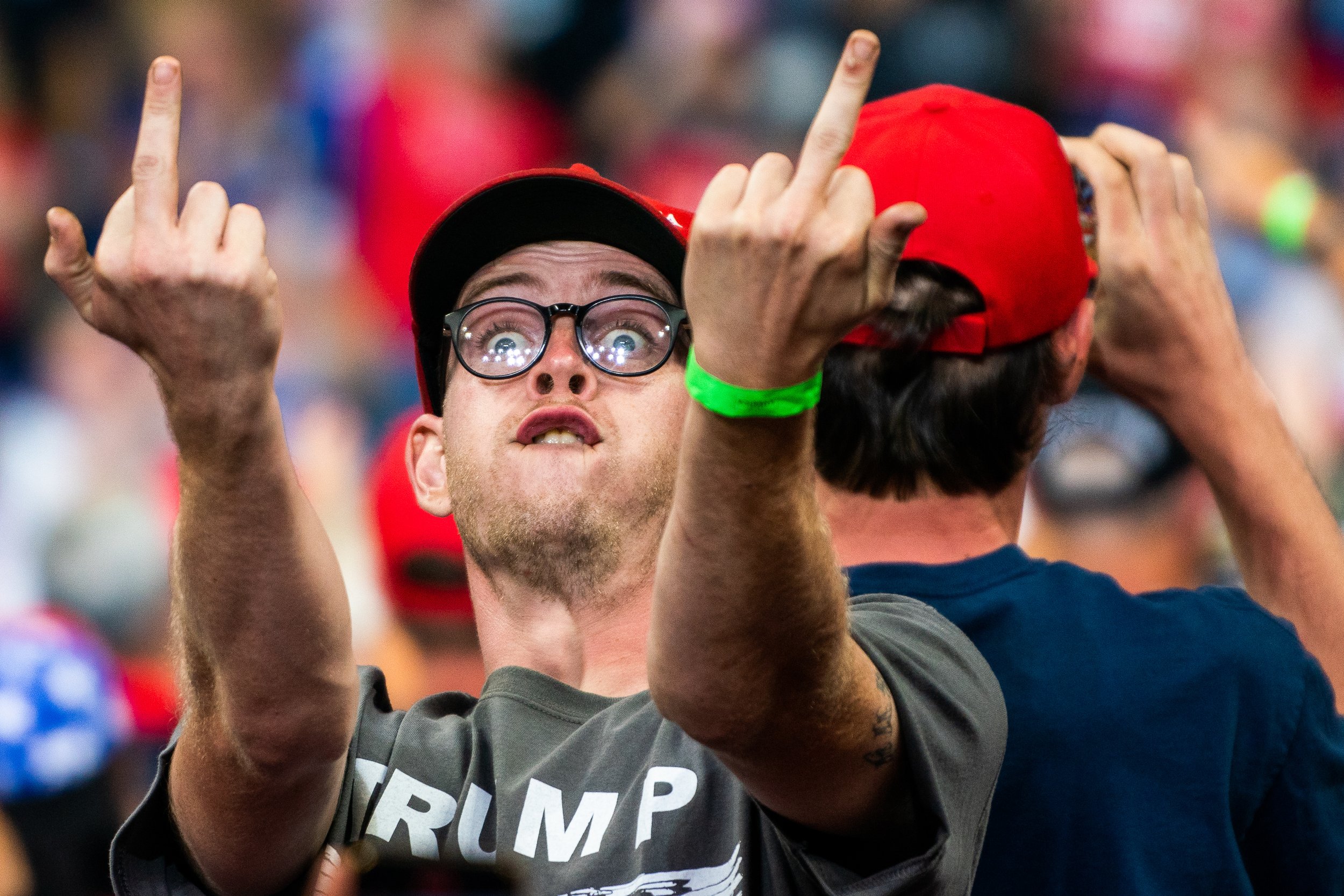  A supporter flicks off the press while listening to Former US President Donald Trump during a rally for Pennsylvania Republican candidate Dr. Mehmet Oz and gubernatorial candidate Doug Mastriano at the Mohegan Sun Arena at Casey Plaza in Wilkes-Barr