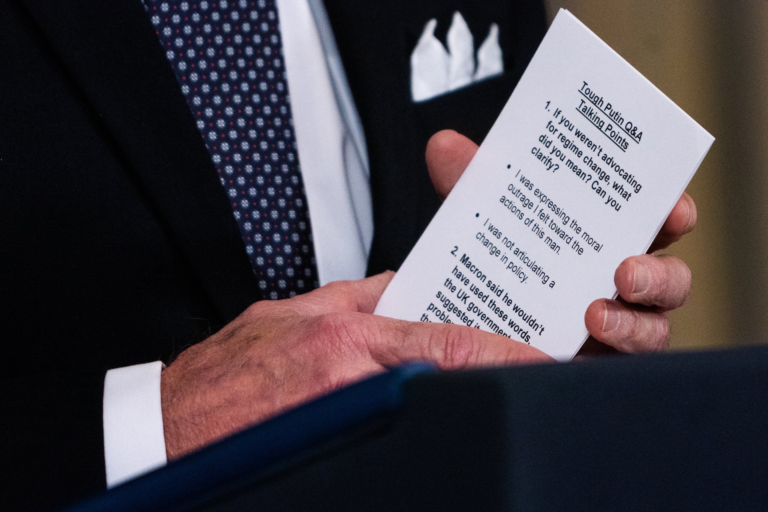  US President Joe Biden holds a notes card with the title “tough Putin Q&amp;A talking points” after delivering remarks regarding his Budget for the Fiscal Year 2023 in the State Dining Room of The White House. 