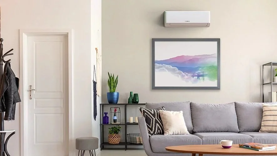 Wall-mounted air-to-air heat pump providing cooling in a home