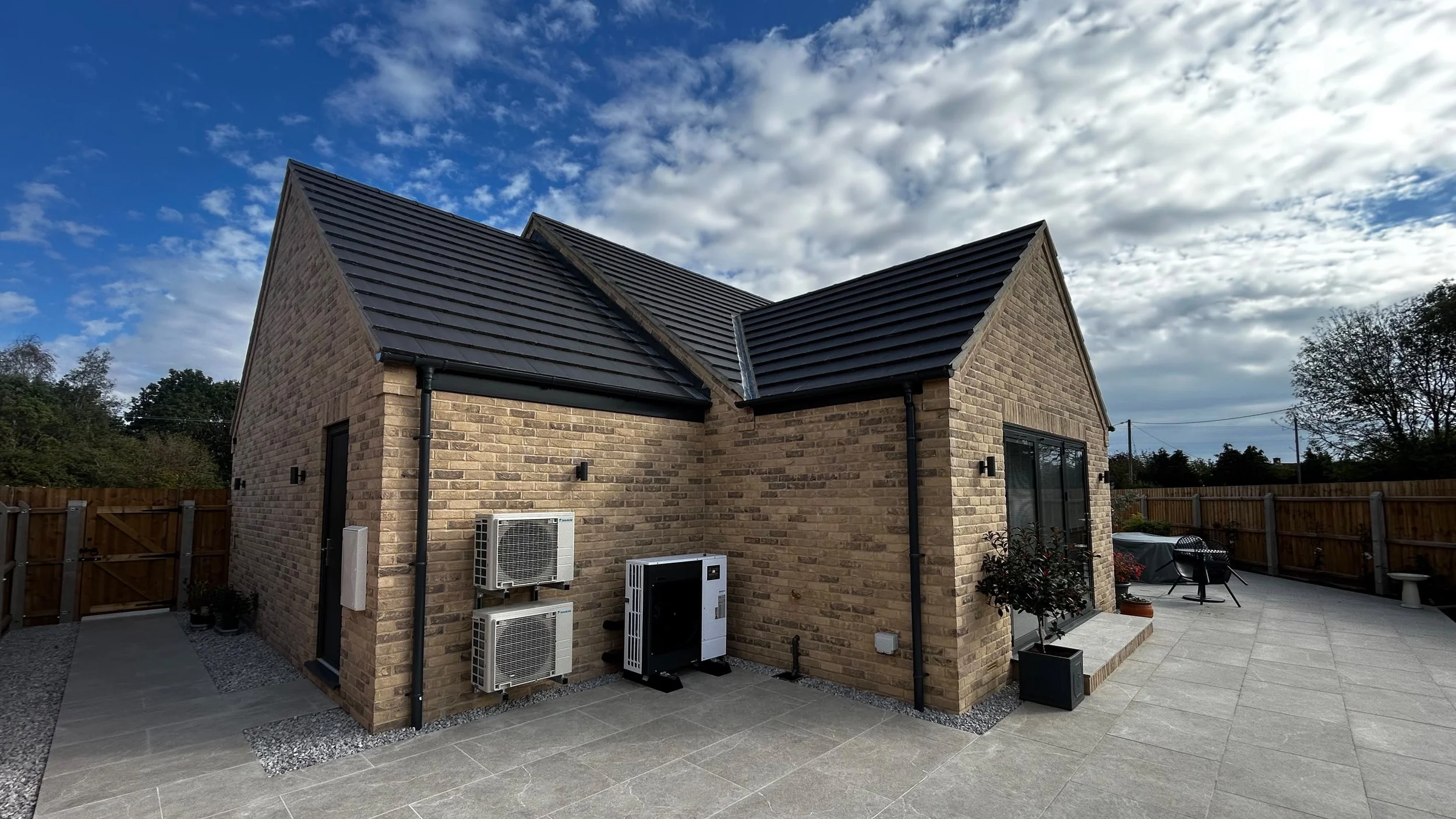 A Mitsubishi heat pump installed alongside air conditioning