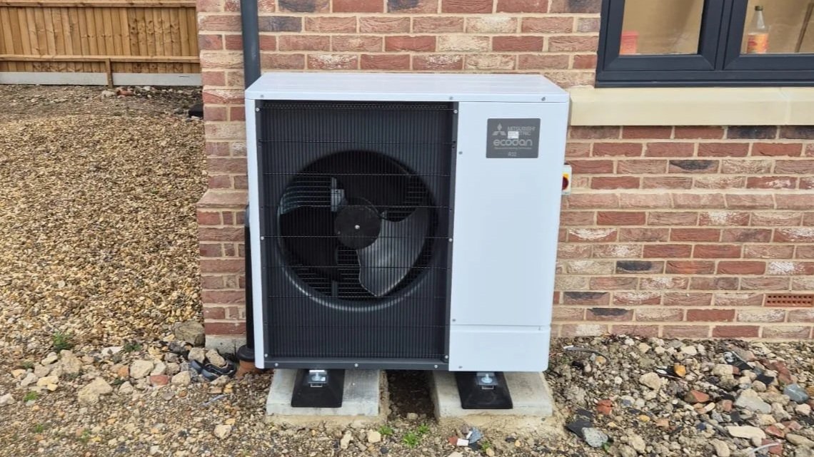 Mitsubishi Ecodan outdoor unit installed as part of an air source heat pump system at a new-build home.