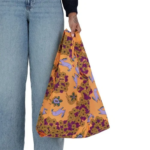 Sustainable foldable shopping bag combining playful style and lasting durability by Baggu.